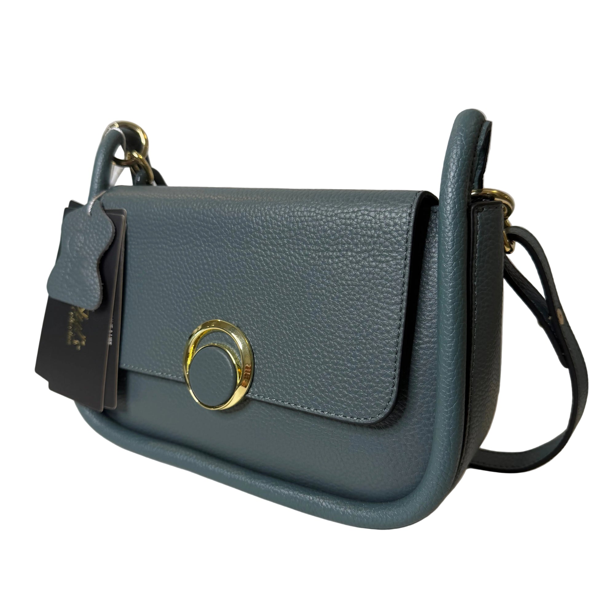 Blue handbag with gold clasp on a light gray background