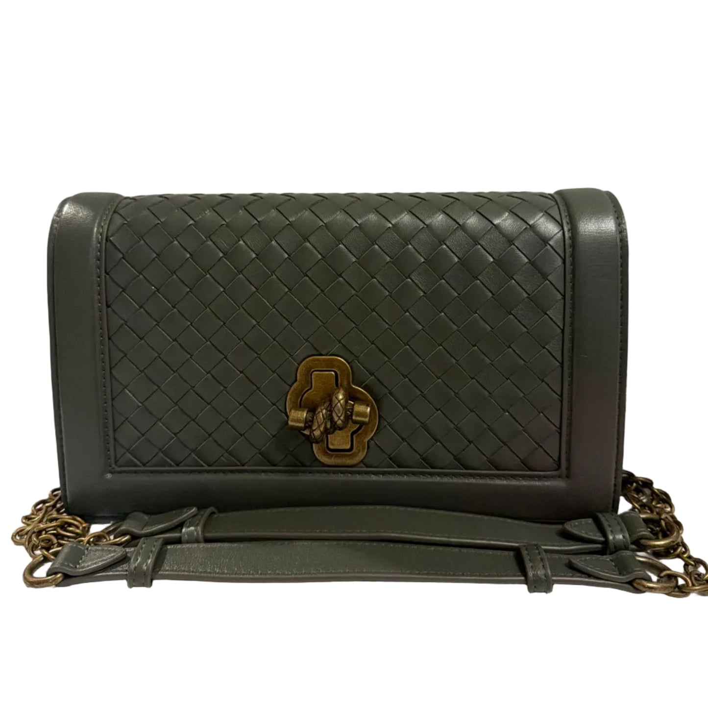 Black woven handbag with gold clasp on a white background