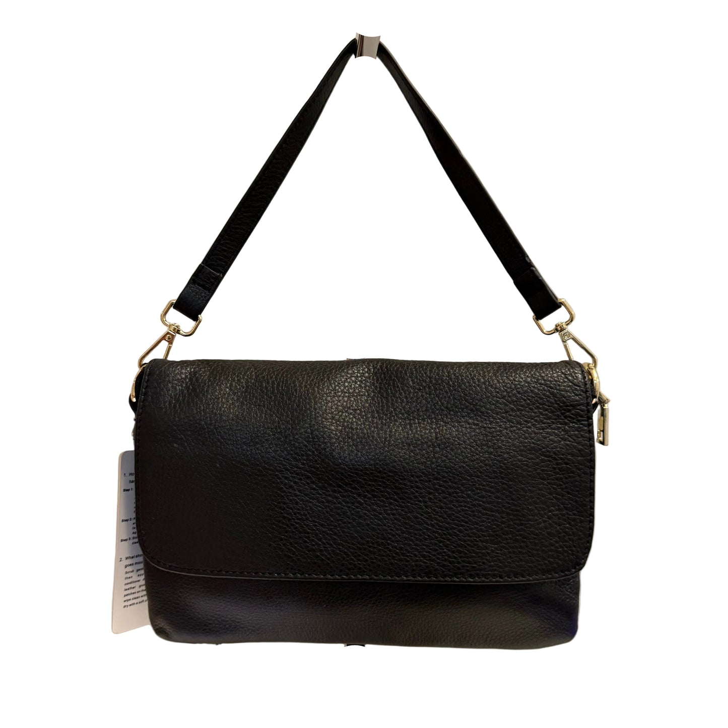 Black leather handbag on a stand against a white background