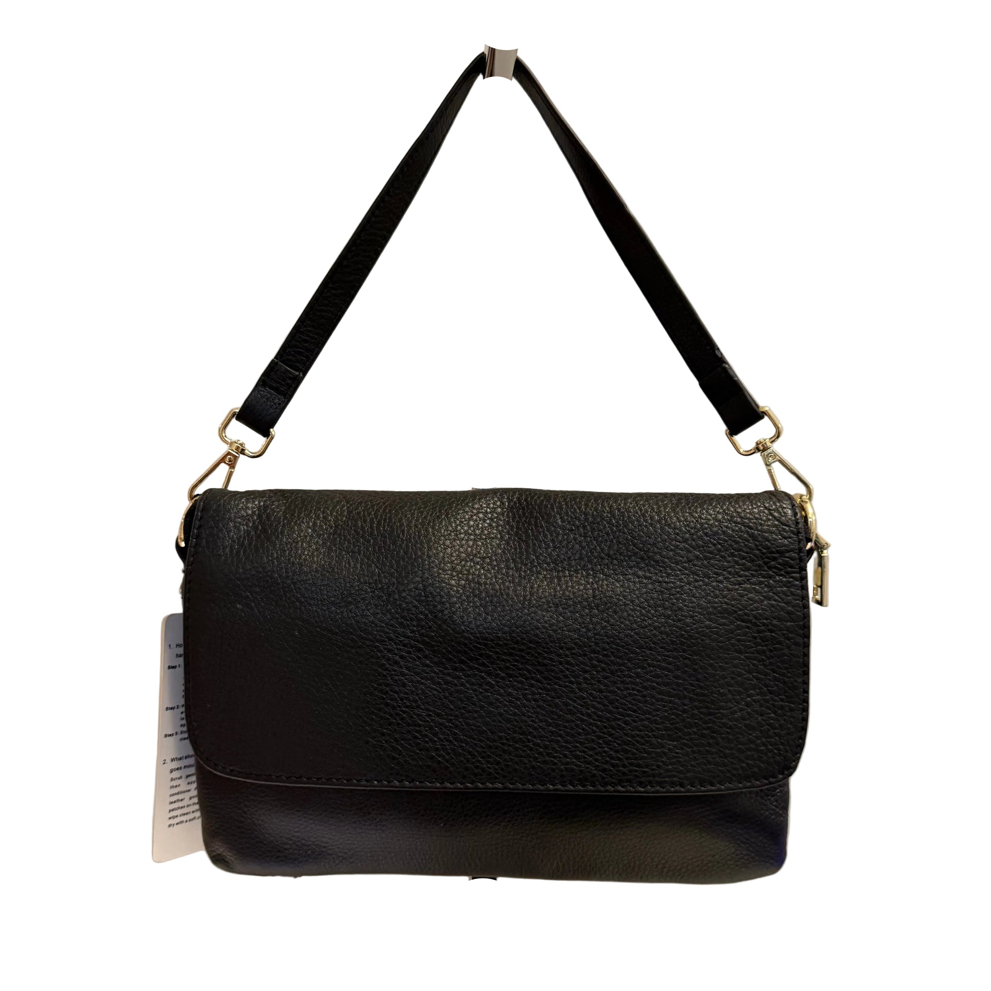 Black leather handbag on a stand against a white background