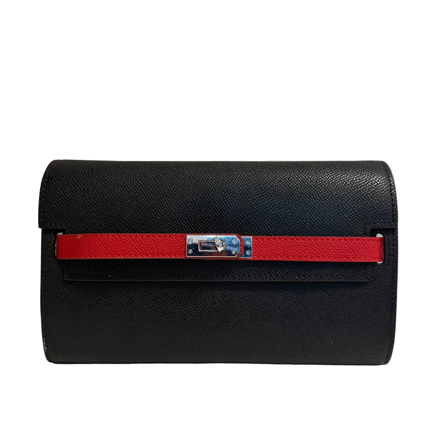 Black clutch bag with a red strap on a light gray background