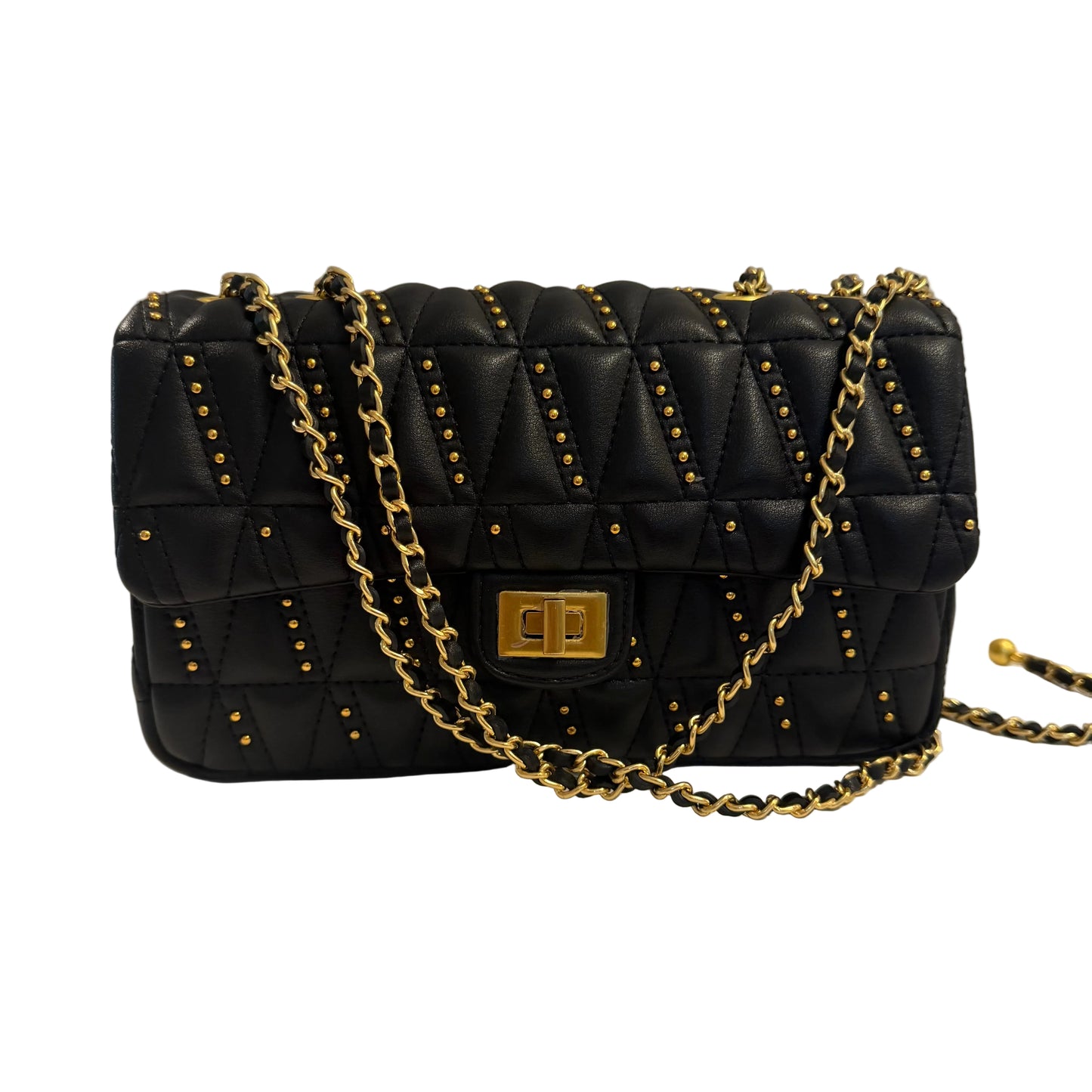 Black quilted handbag with gold chain strap on a light gray background