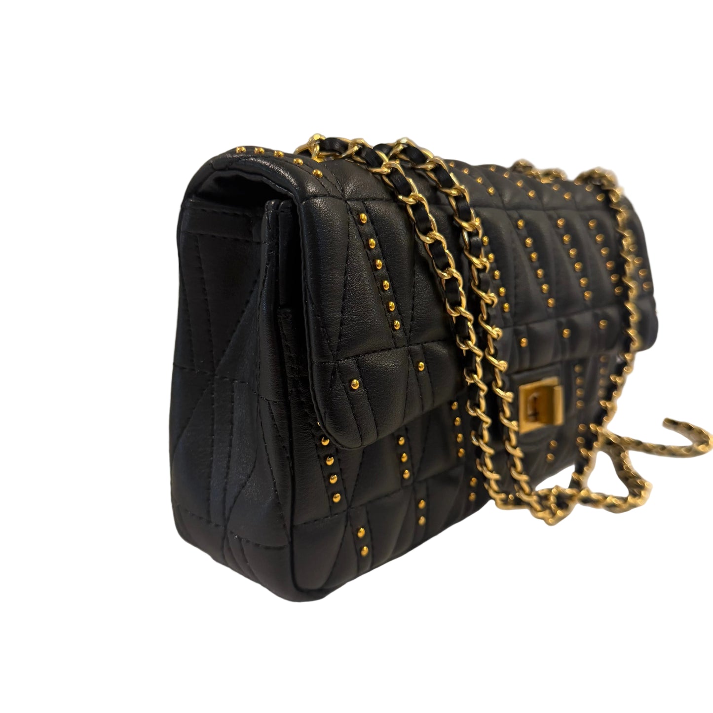 Black quilted handbag with gold chain strap on a light gray background