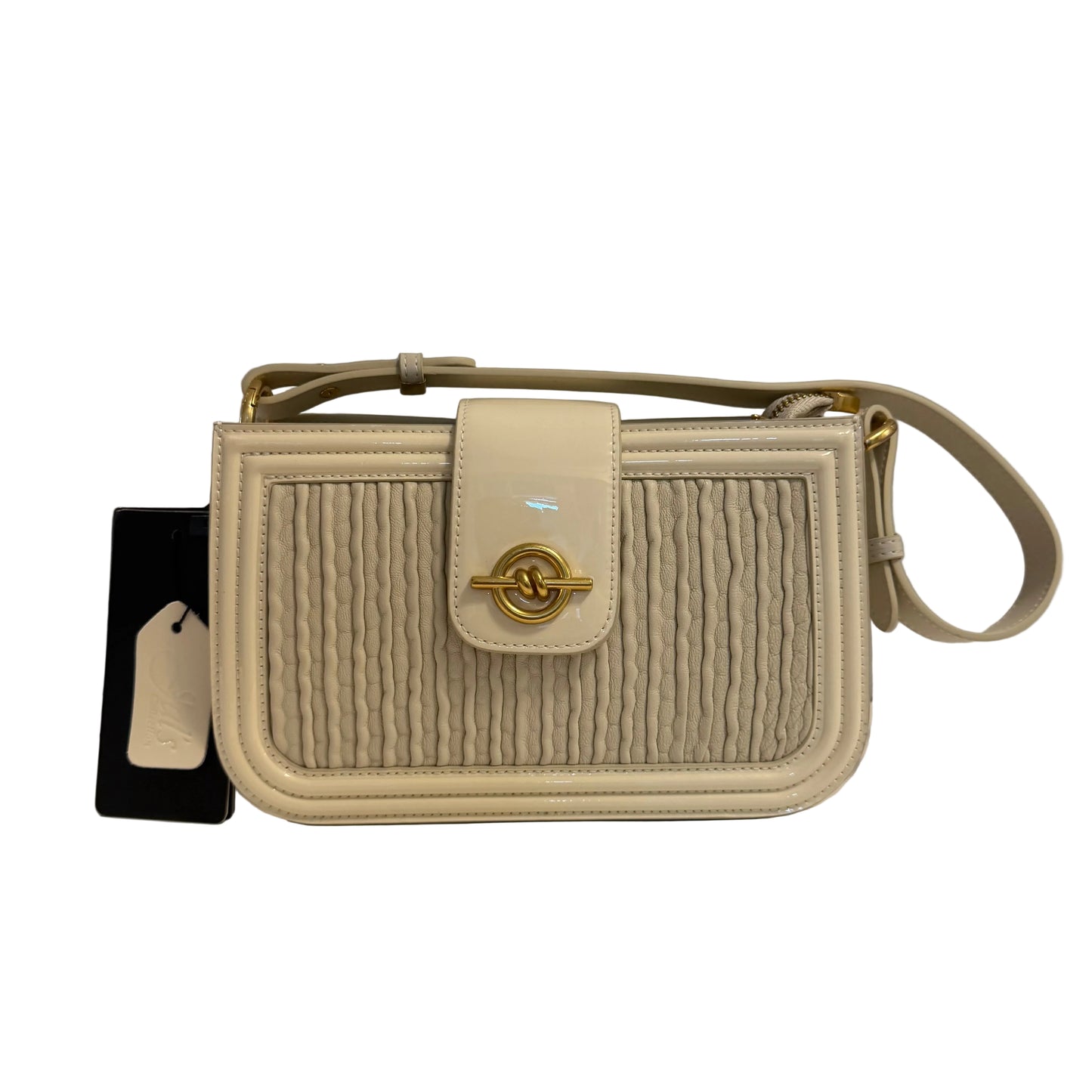 Beige textured handbag with gold accents on a gray background
