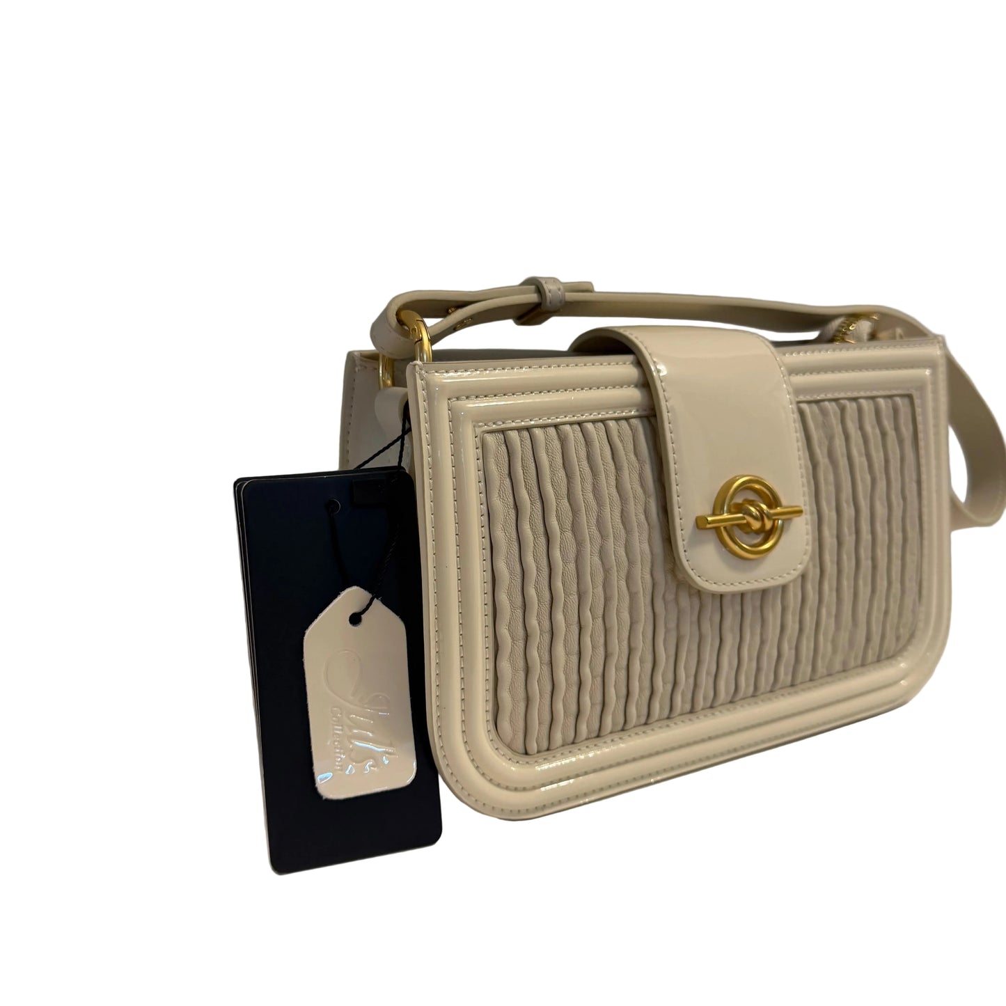 Beige handbag with gold clasp on a white surface with a gray background