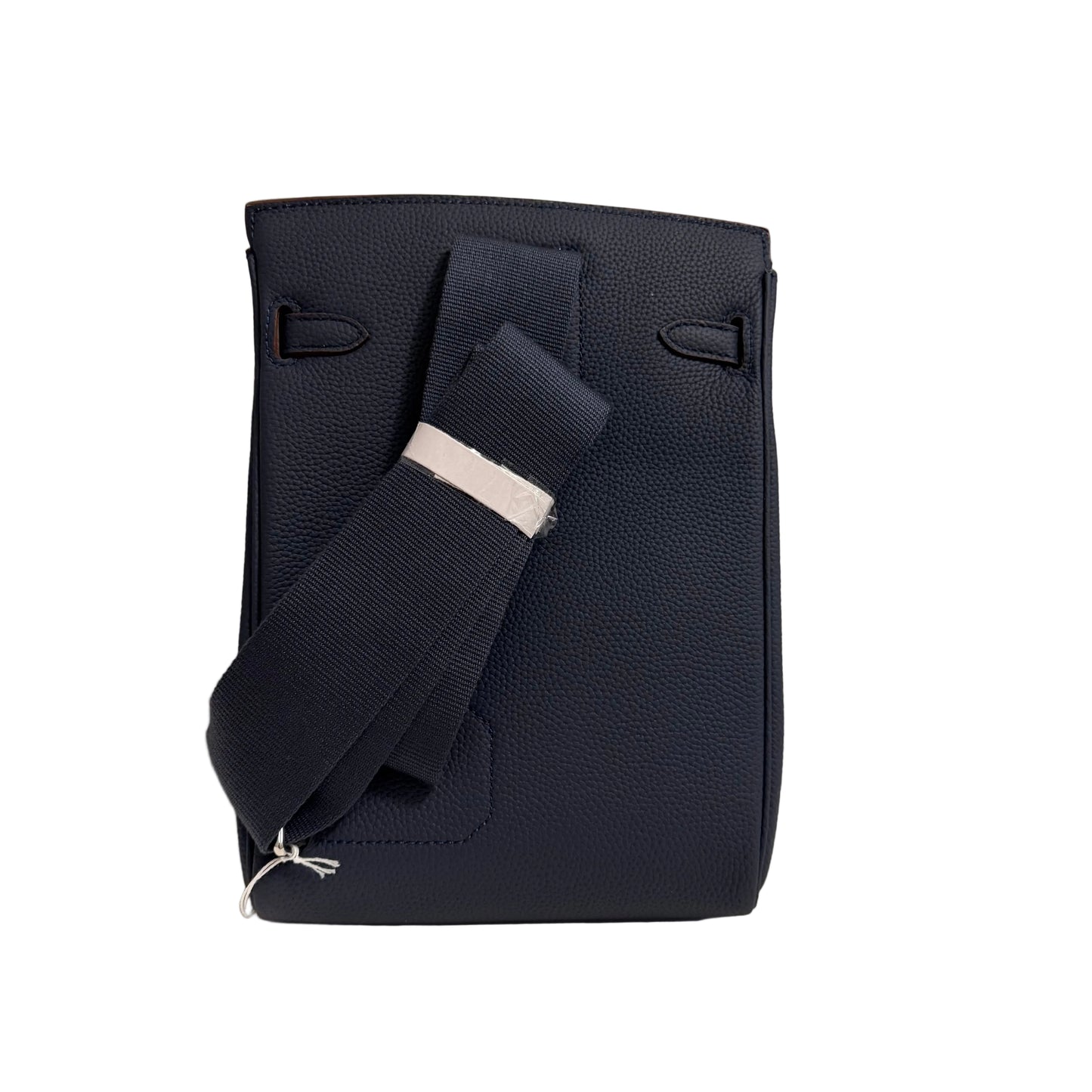 Navy blue leather bag with a strap on a light gray background