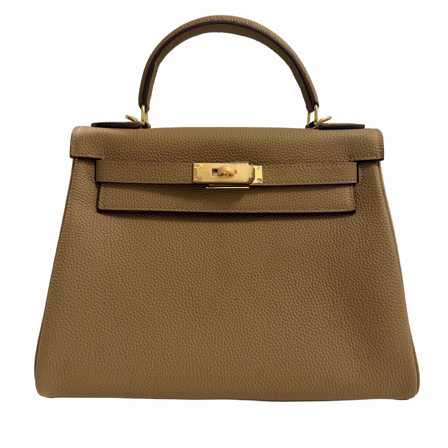 Brown leather handbag with gold hardware on a light gray background