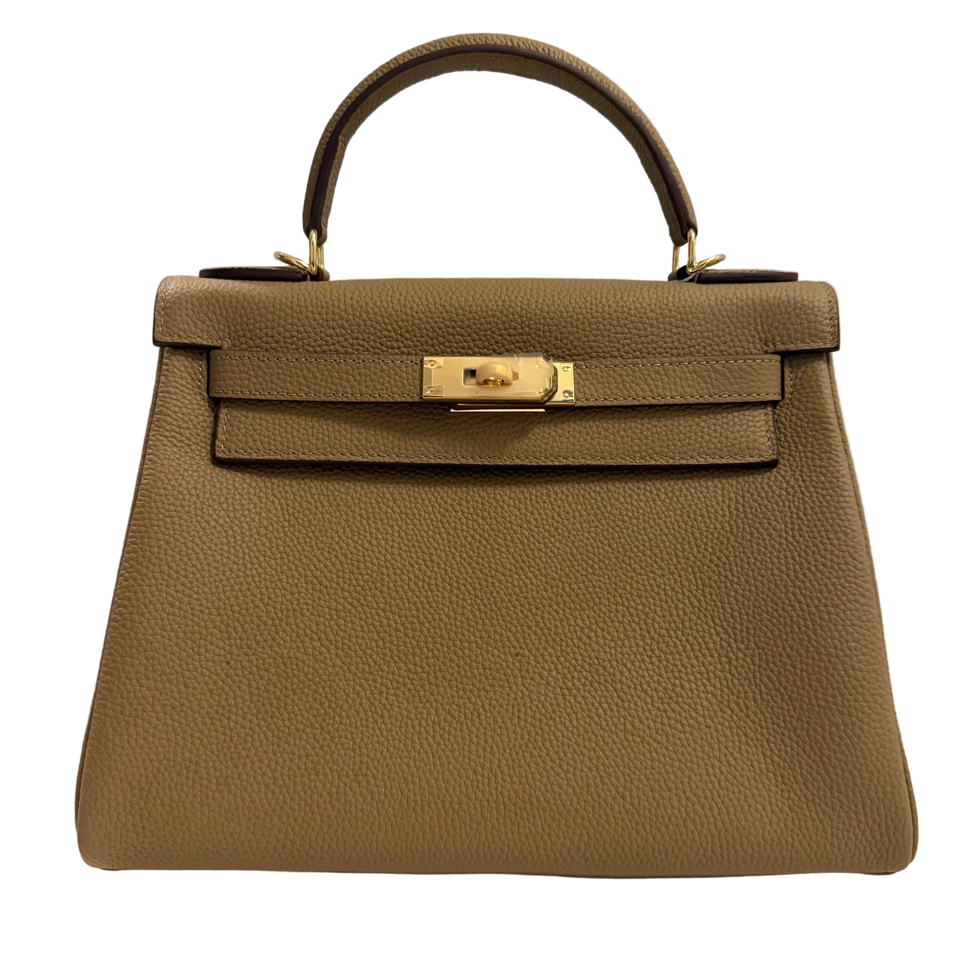 Brown leather handbag with gold hardware on a light gray background
