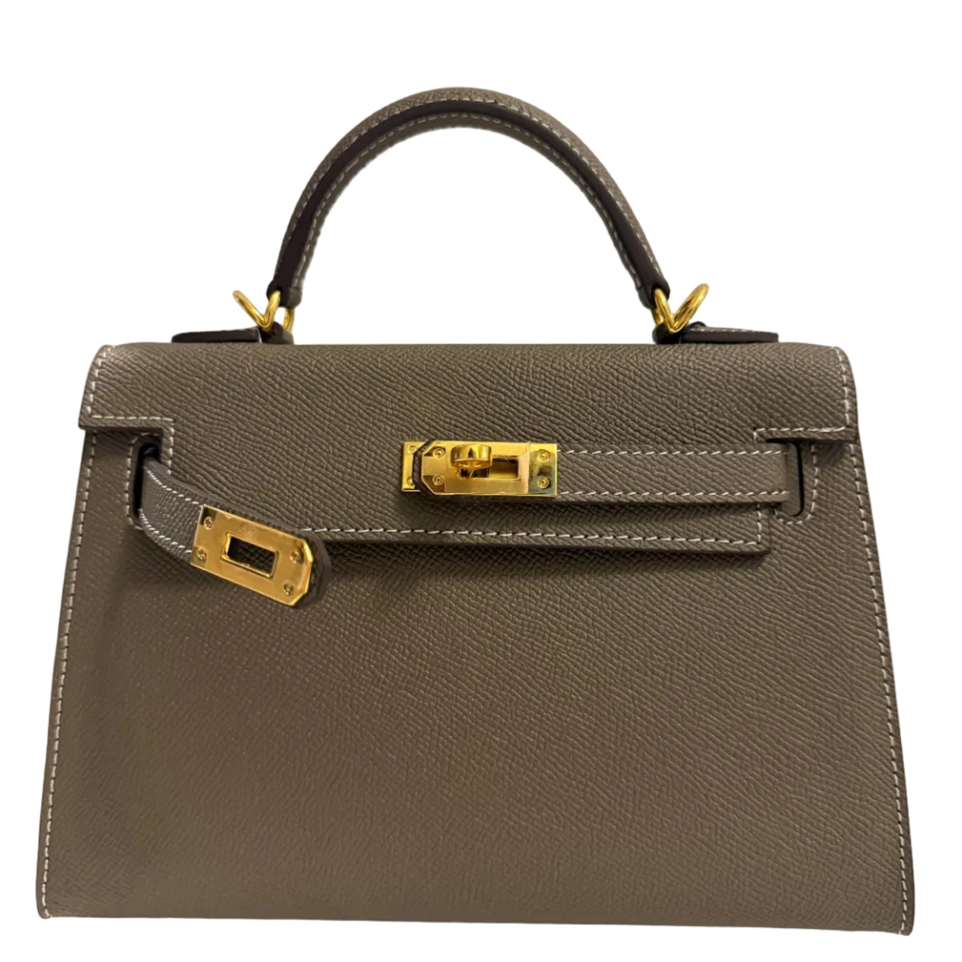Gray handbag with gold hardware on a light gray background