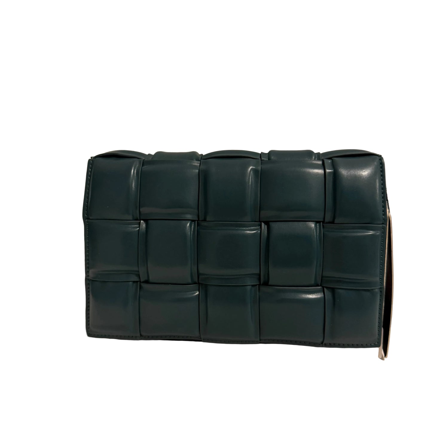 Green woven clutch bag on a beige background