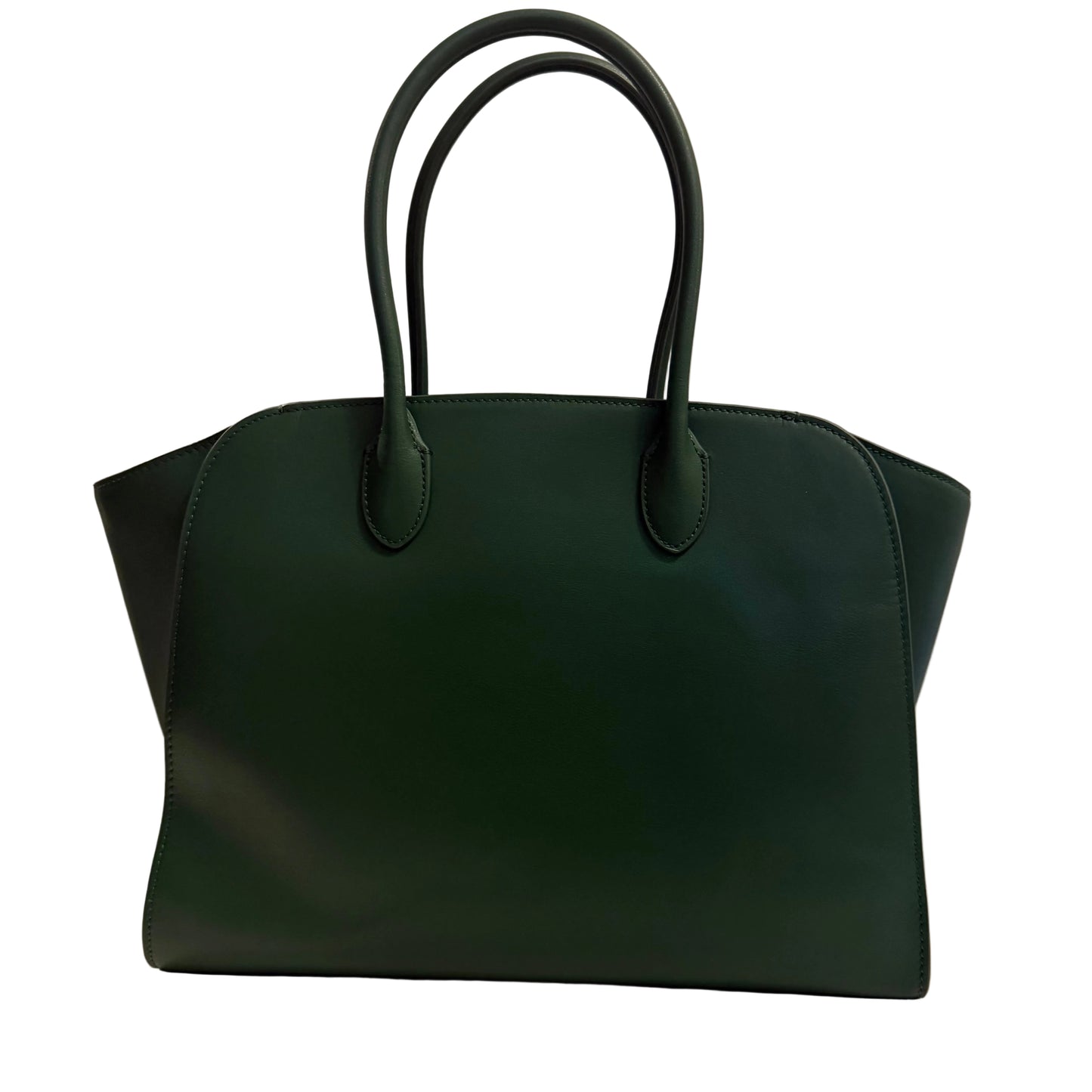 Green handbag on a light surface with a neutral background