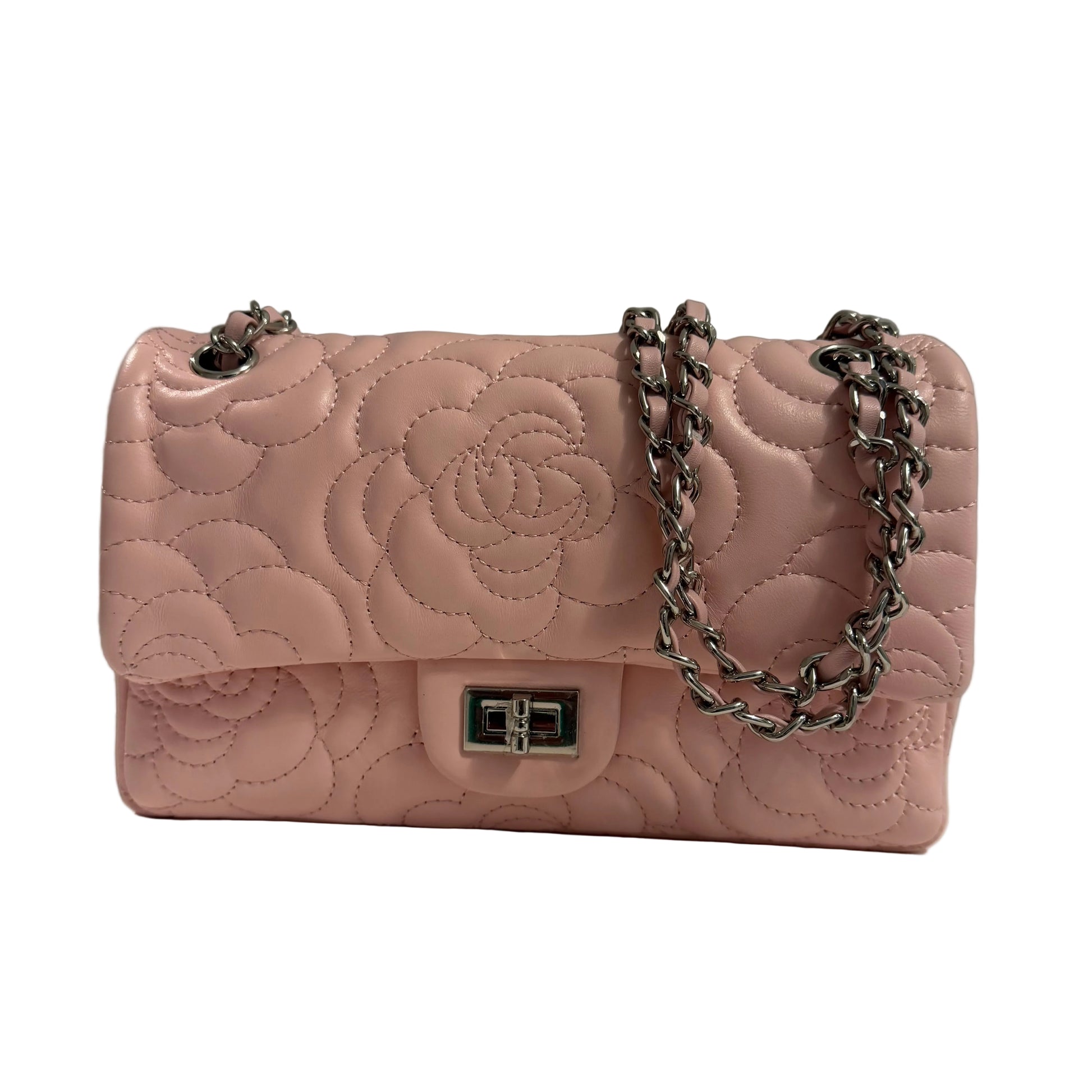 Pink quilted handbag with a chain strap on a neutral background