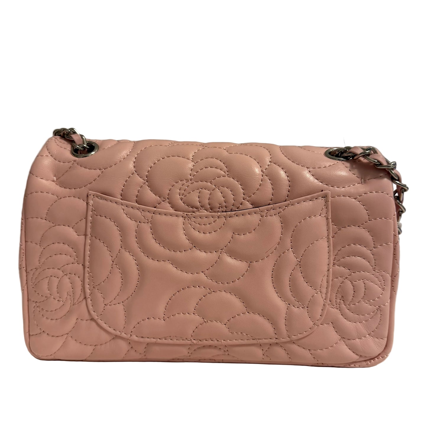 Quilted pink handbag on a neutral background