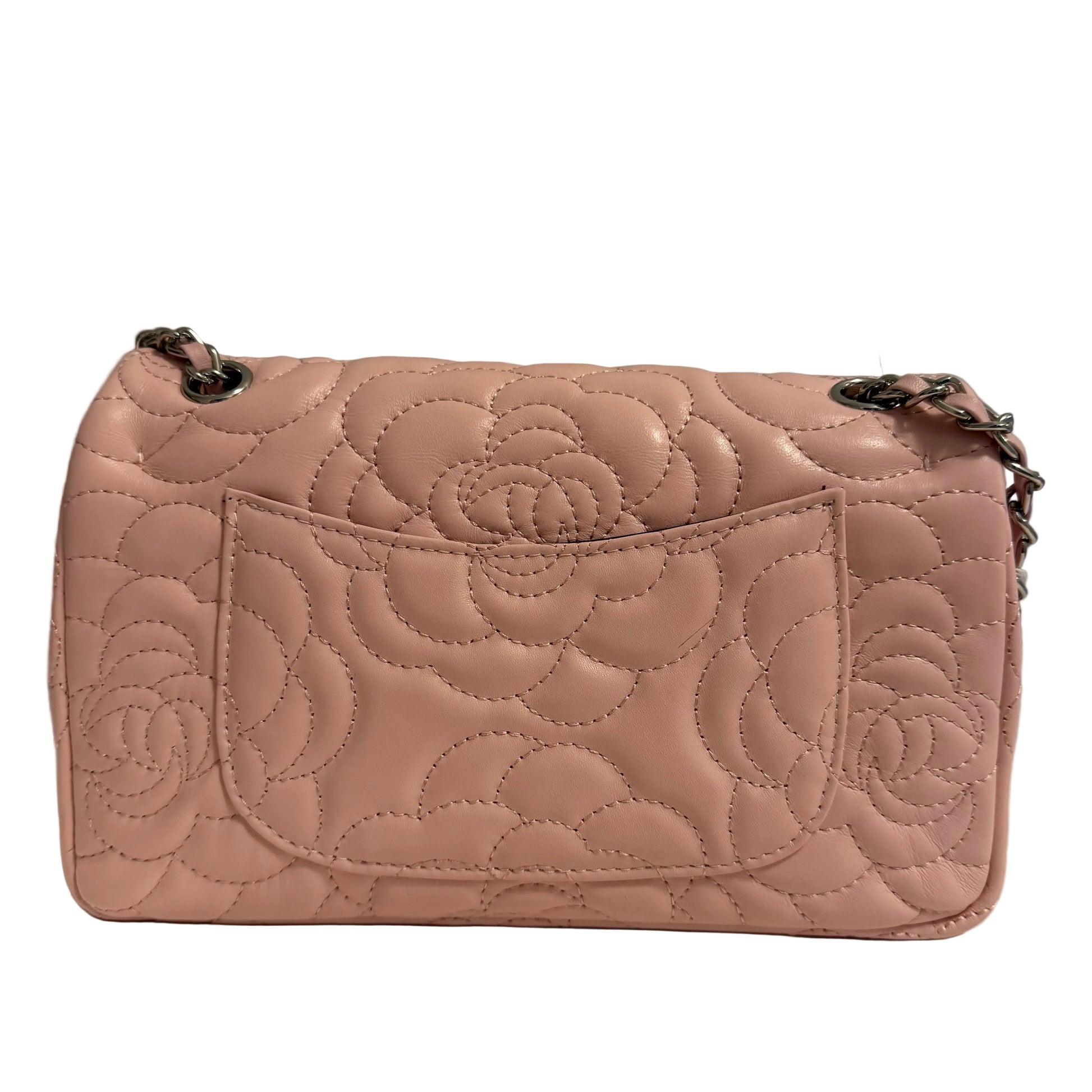 Quilted pink handbag on a neutral background