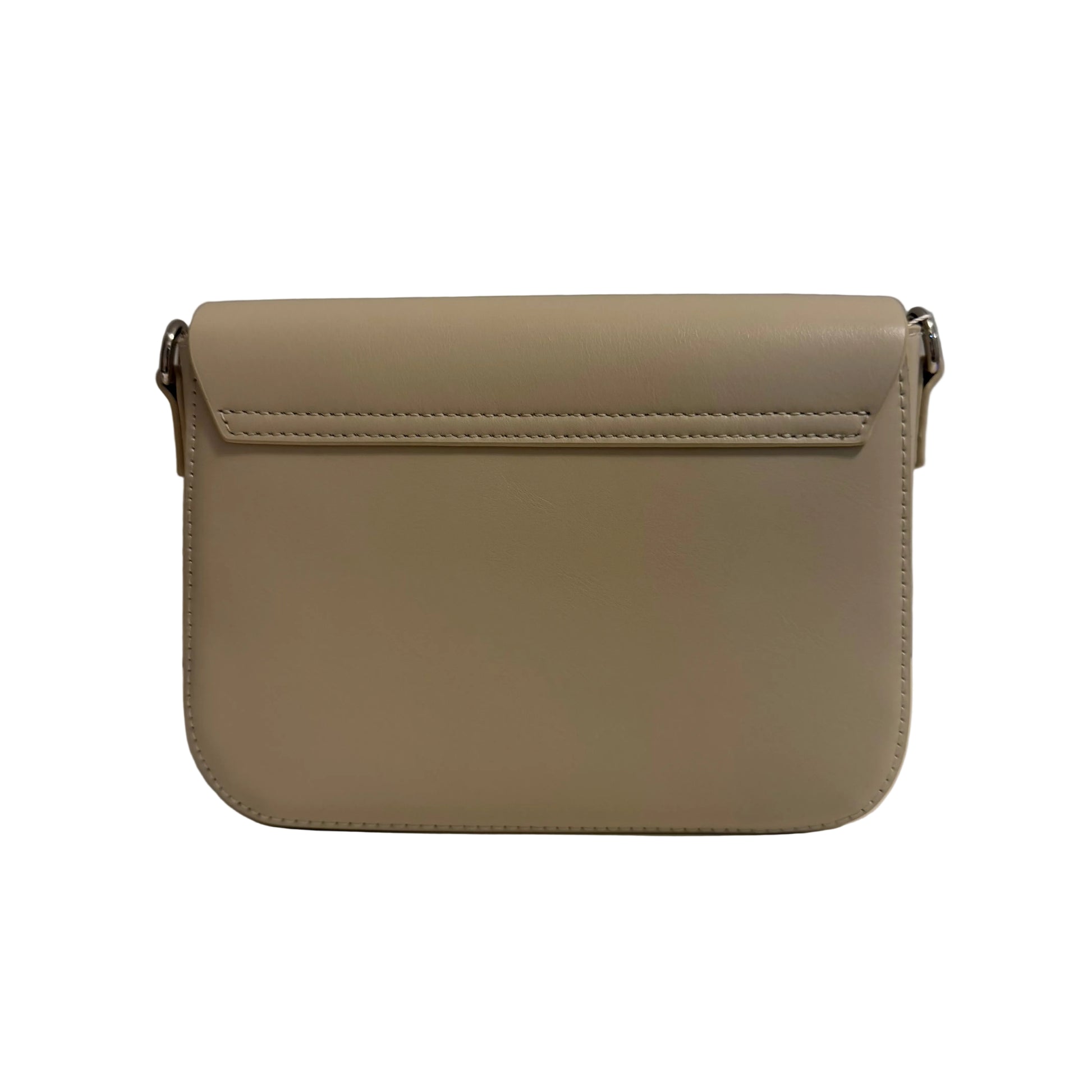 Beige handbag on a white surface with a gray background