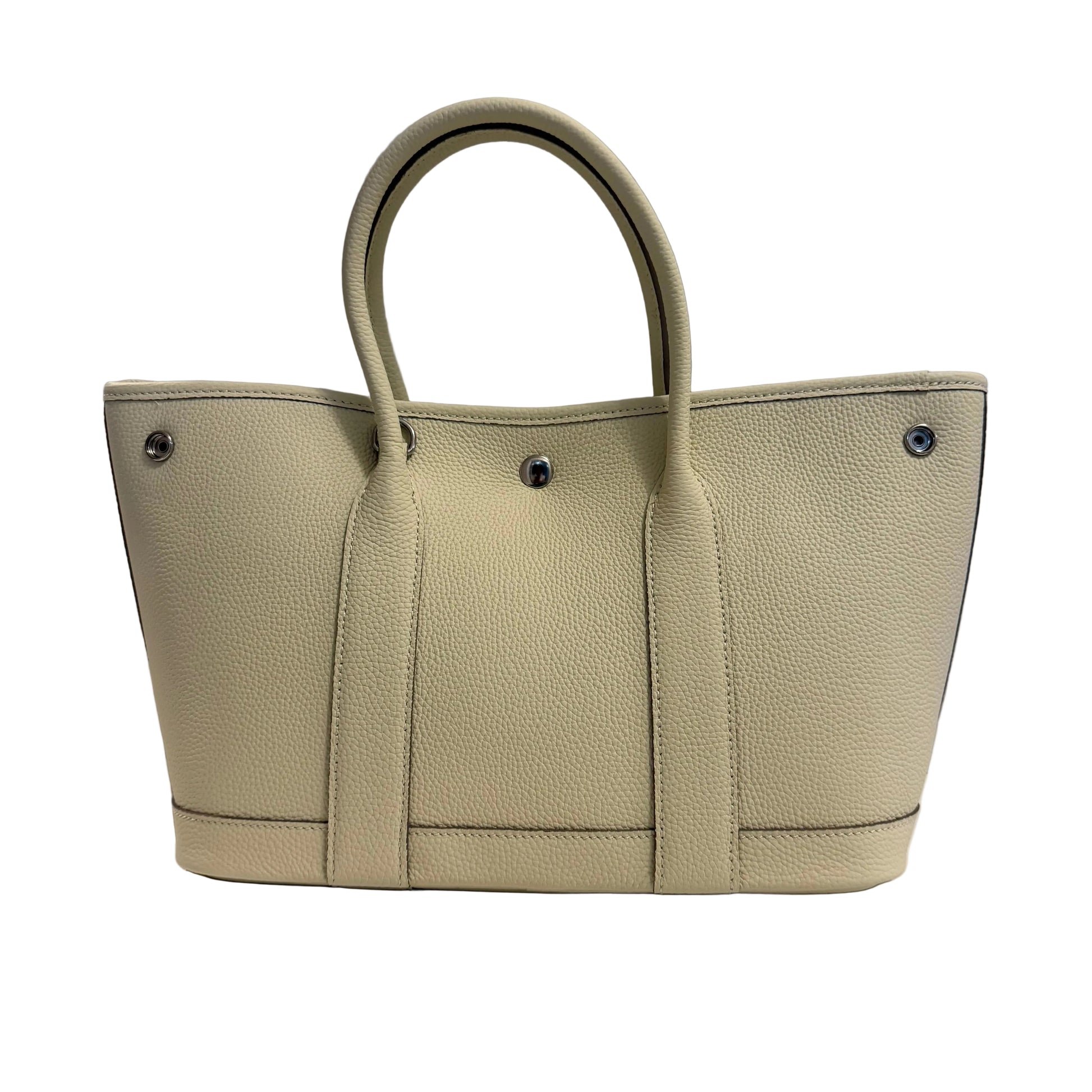 Beige handbag on a gray background