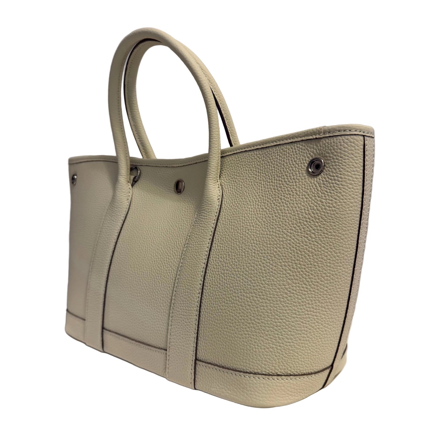 Beige handbag on a gray background