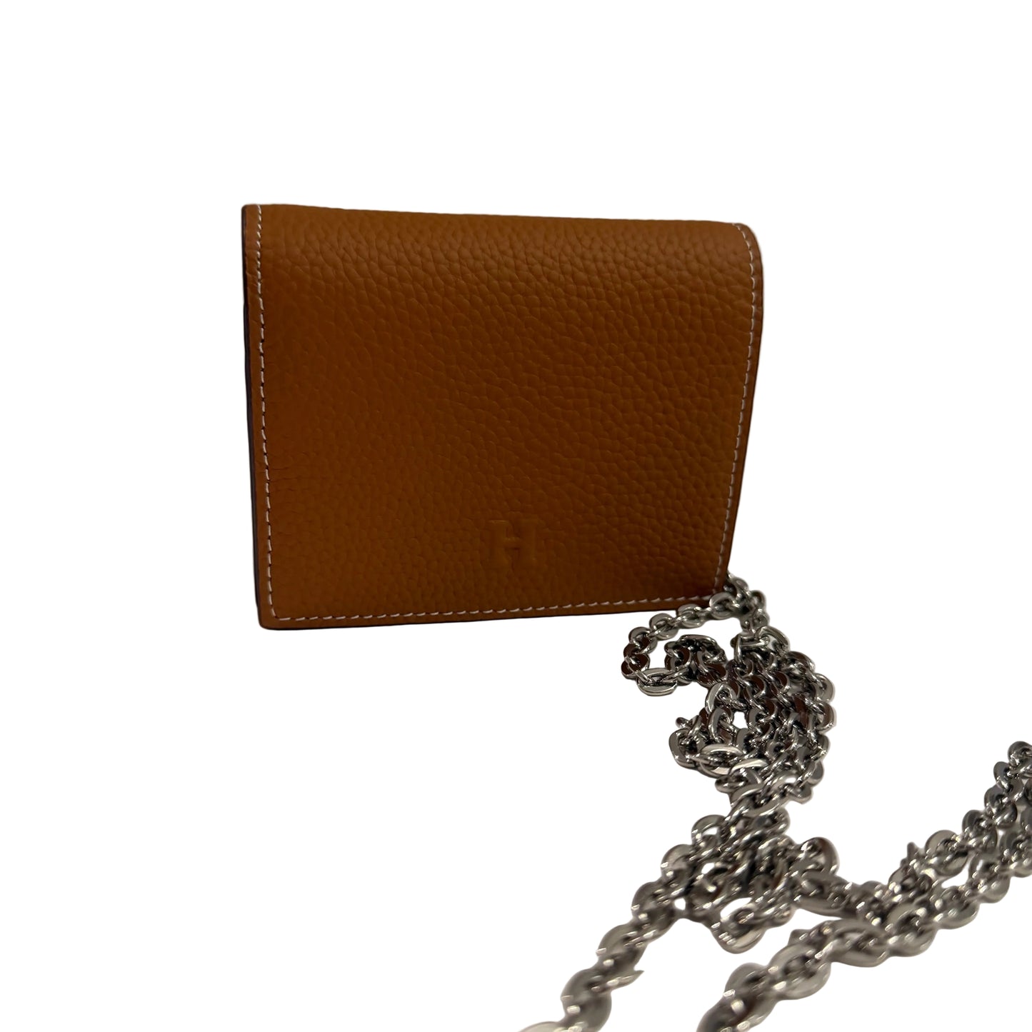Brown leather wallet with a chain on a light surface and gray background