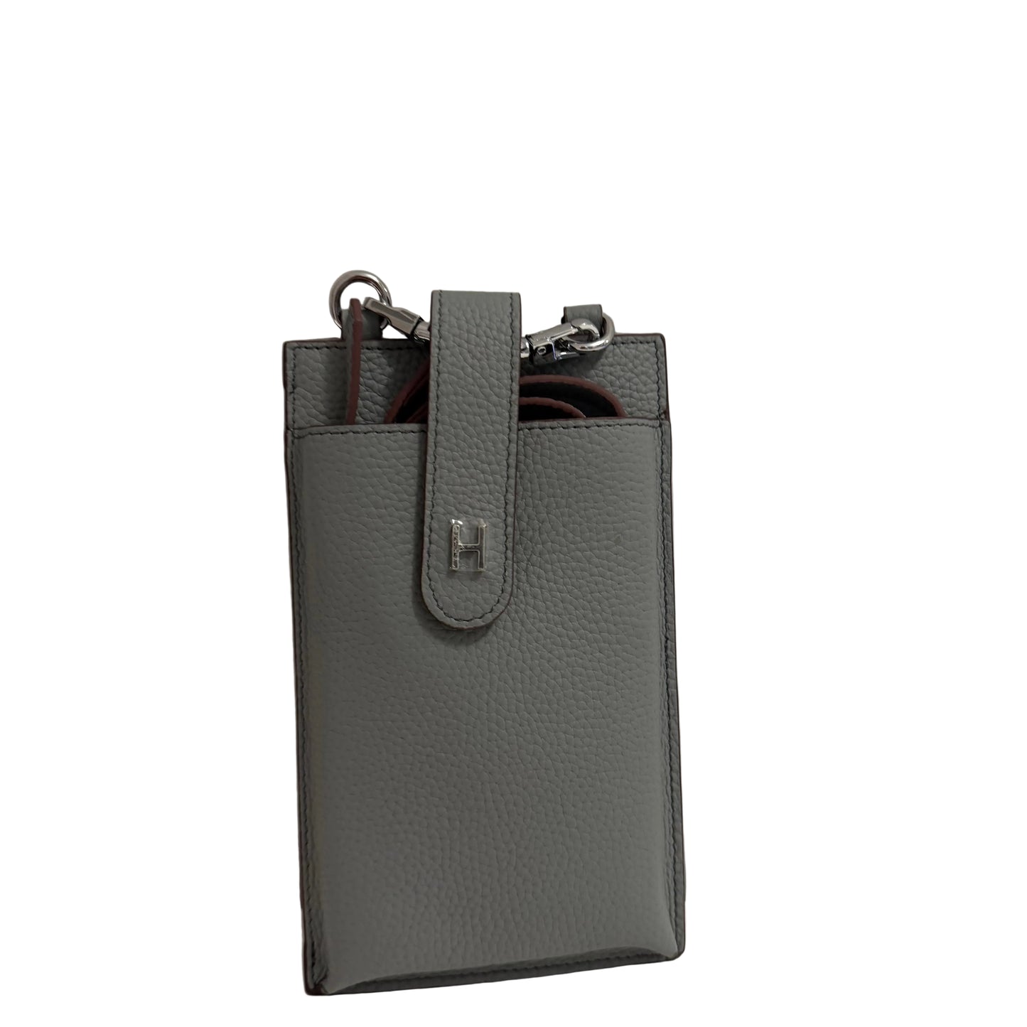 Gray leather phone case with a strap on a light gray background