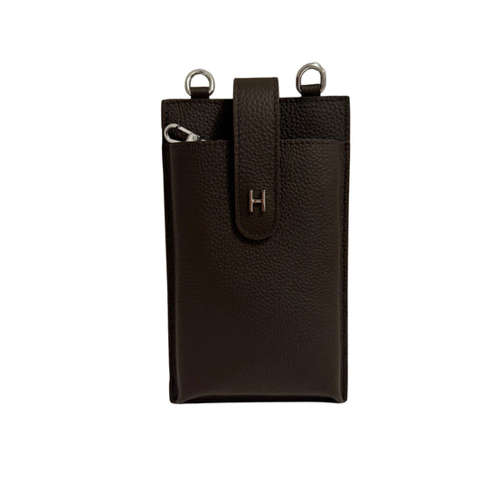 Brown leather pouch with a strap on a gray background