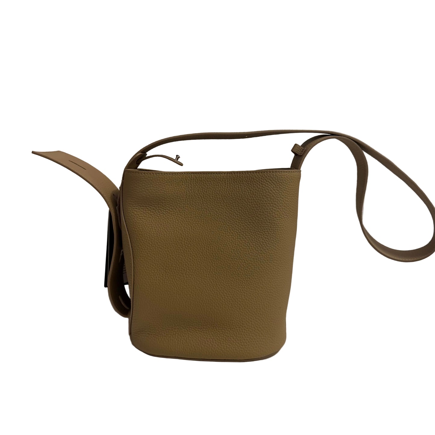 Brown leather bag with a strap on a white surface and light gray background