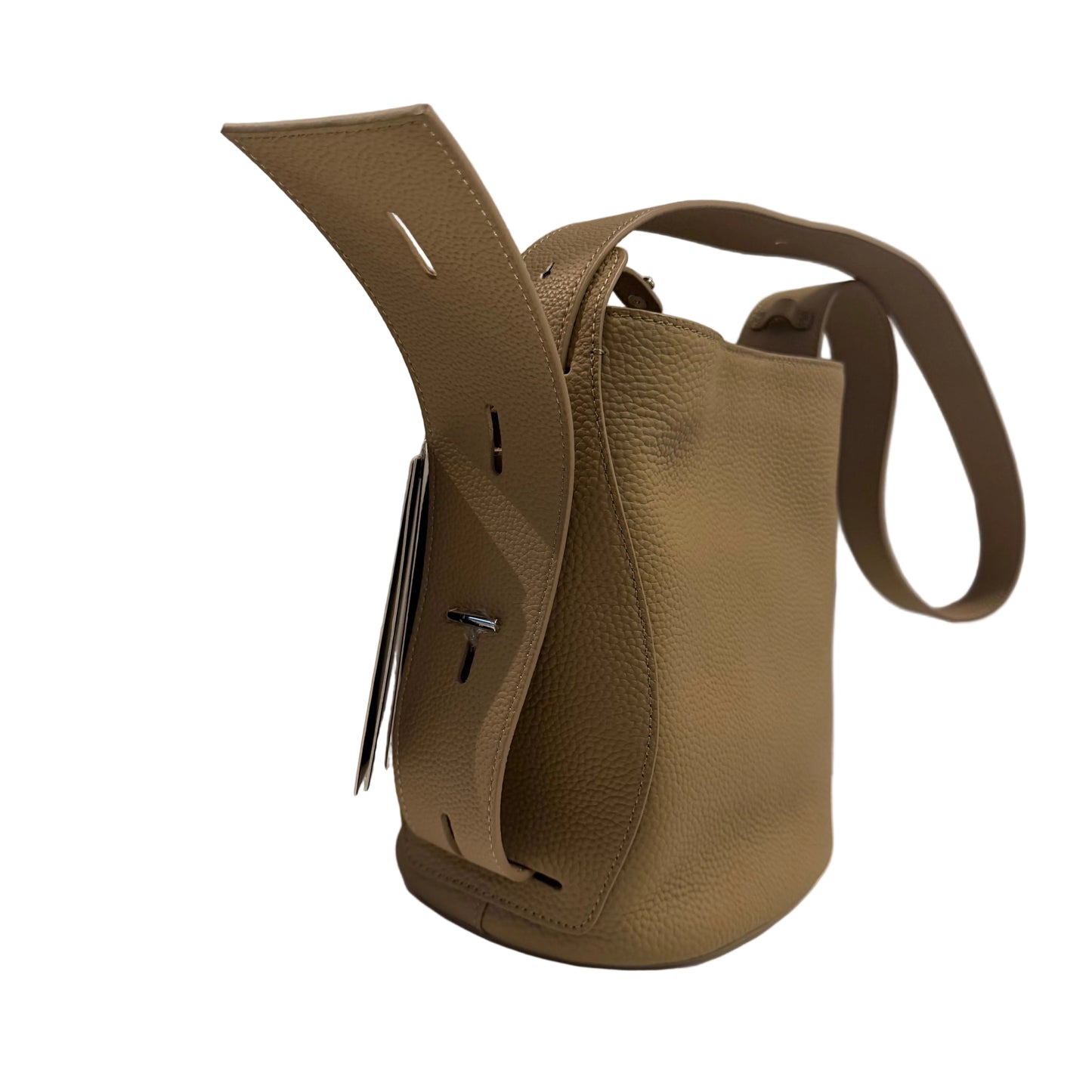 Brown leather bag with a strap on a white surface