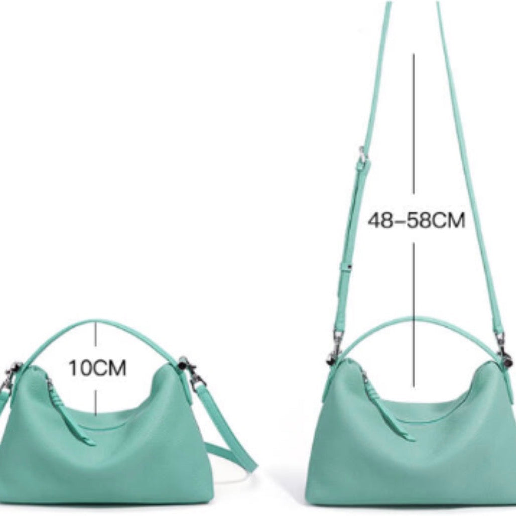 Green handbag with measurements on a white background