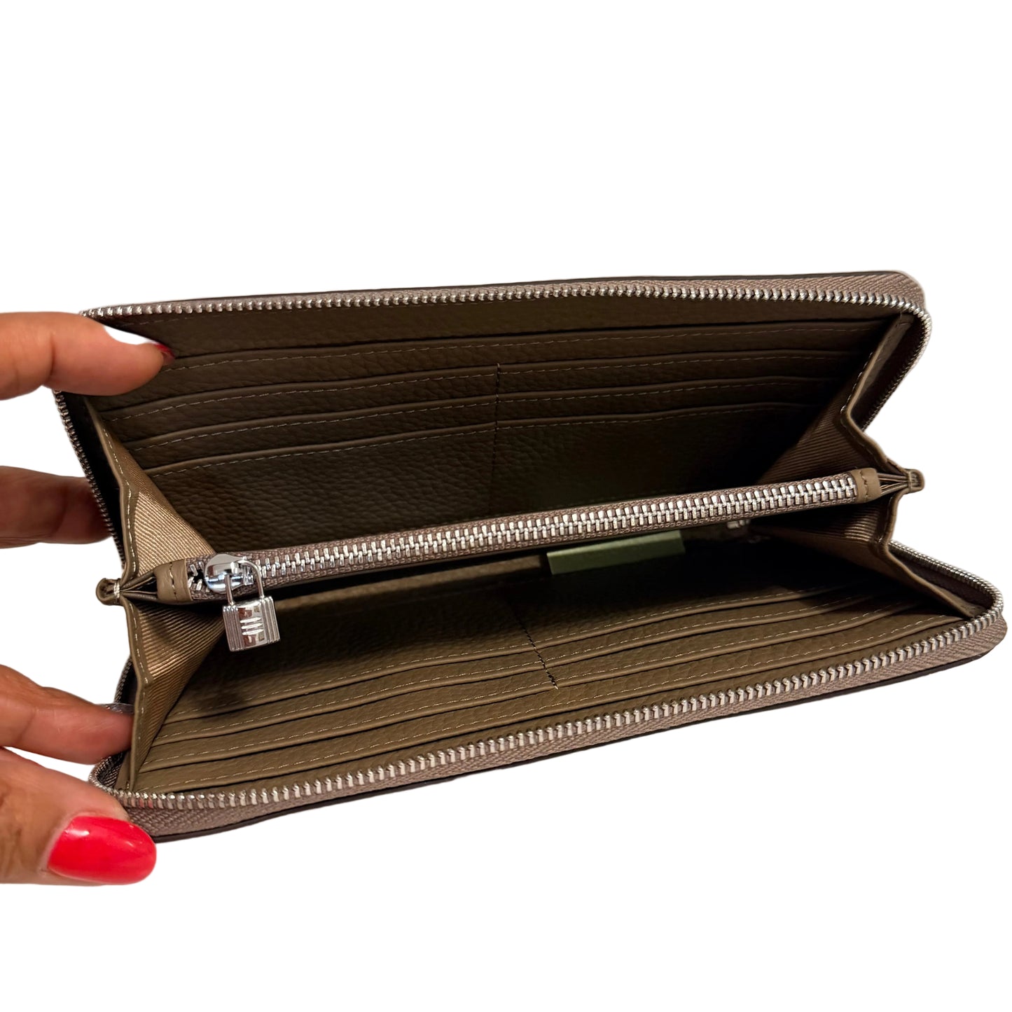 Open beige wallet with a hand holding it on a white background