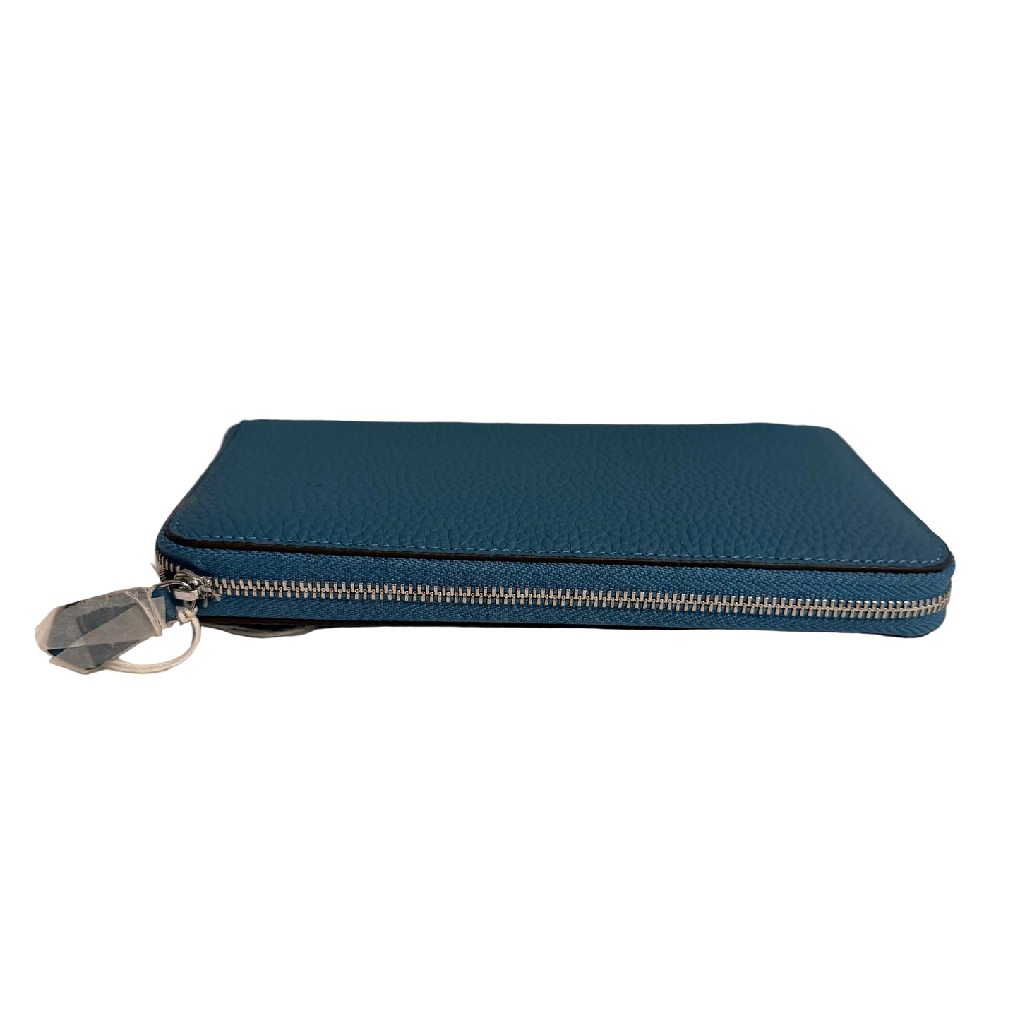 Blue zippered pouch on a white surface with a neutral background