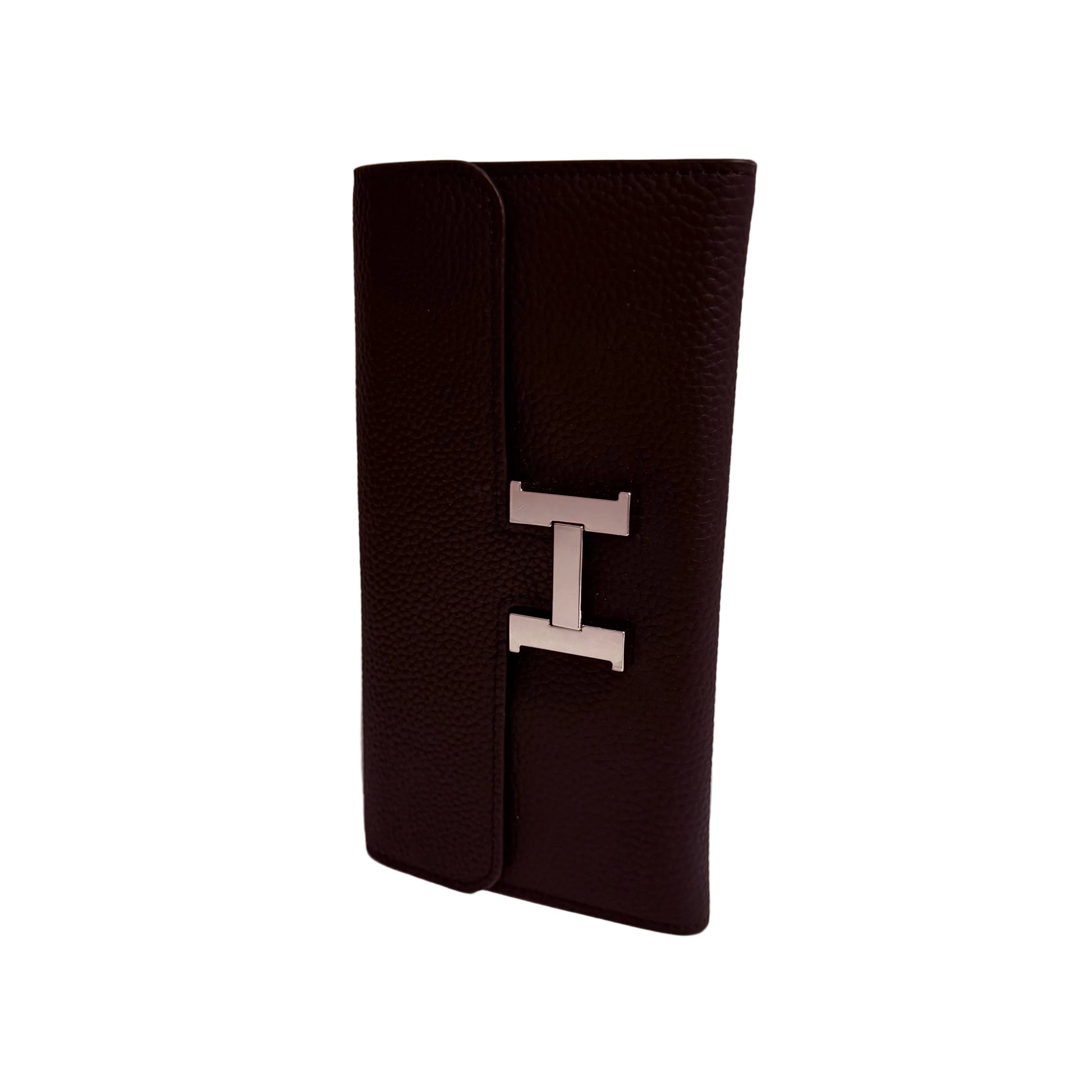 Black leather wallet with a silver 'H' logo on a white surface and light gray background