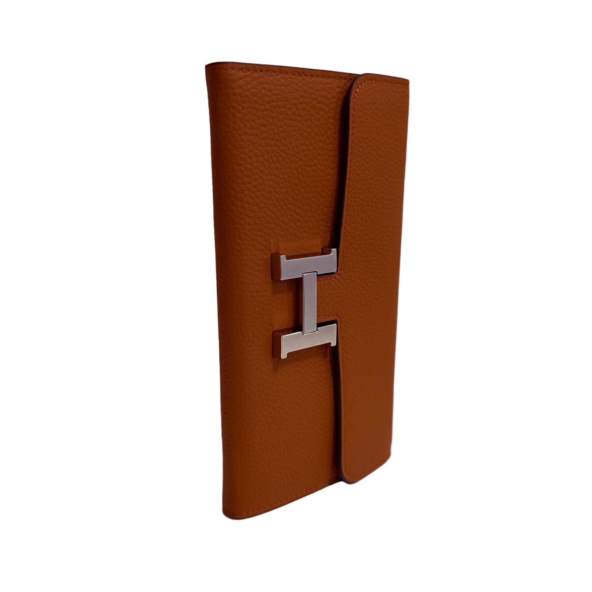Brown leather wallet with a silver 'H' logo on a white surface and light gray background