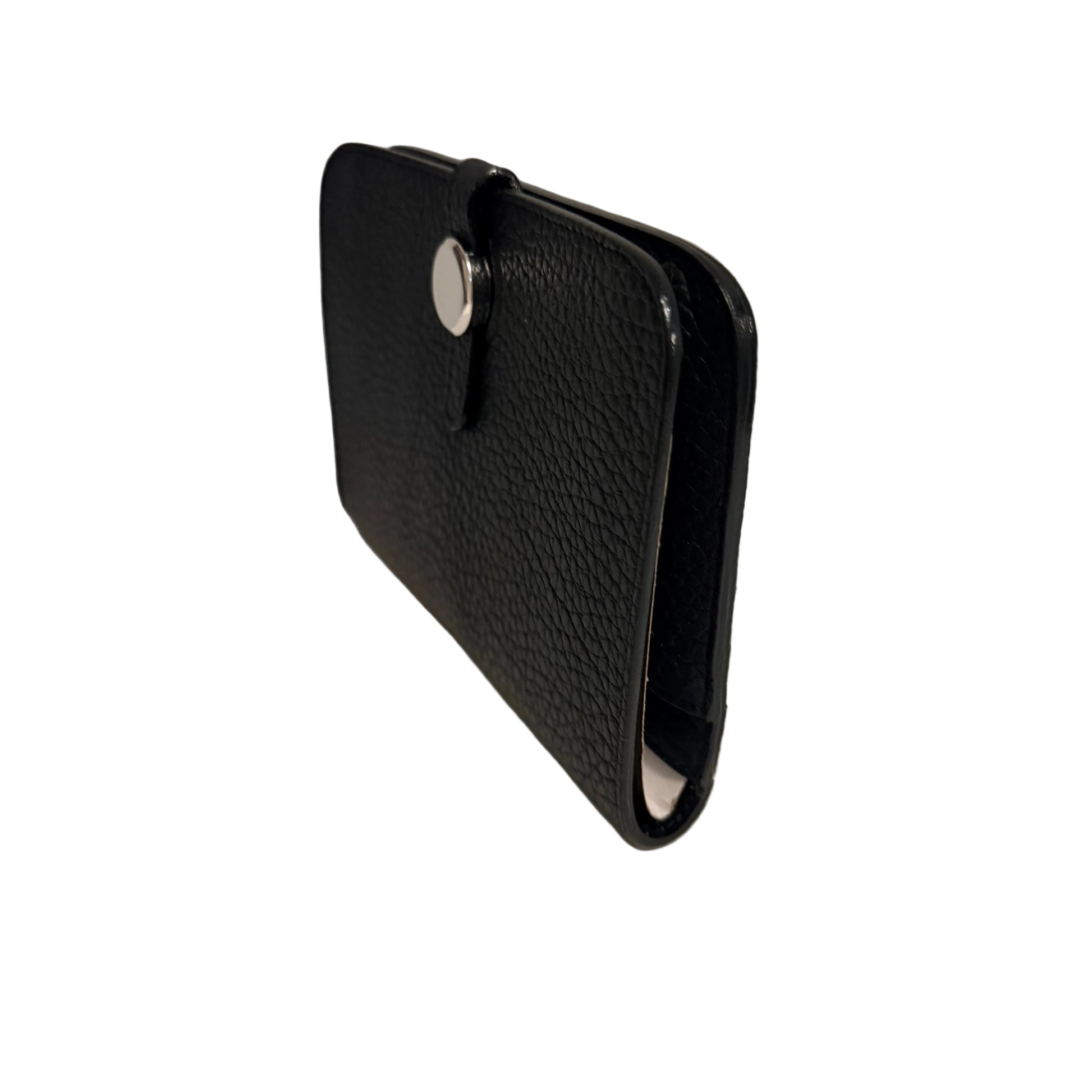 Black leather wallet on a white surface with a gray background