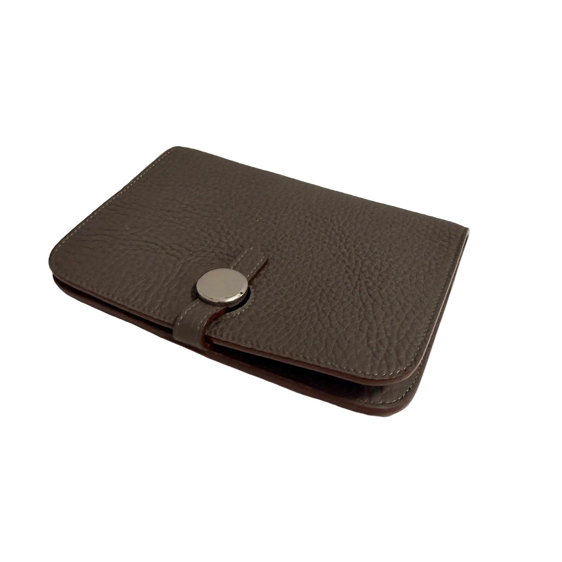 Brown leather wallet with a silver button on a white surface