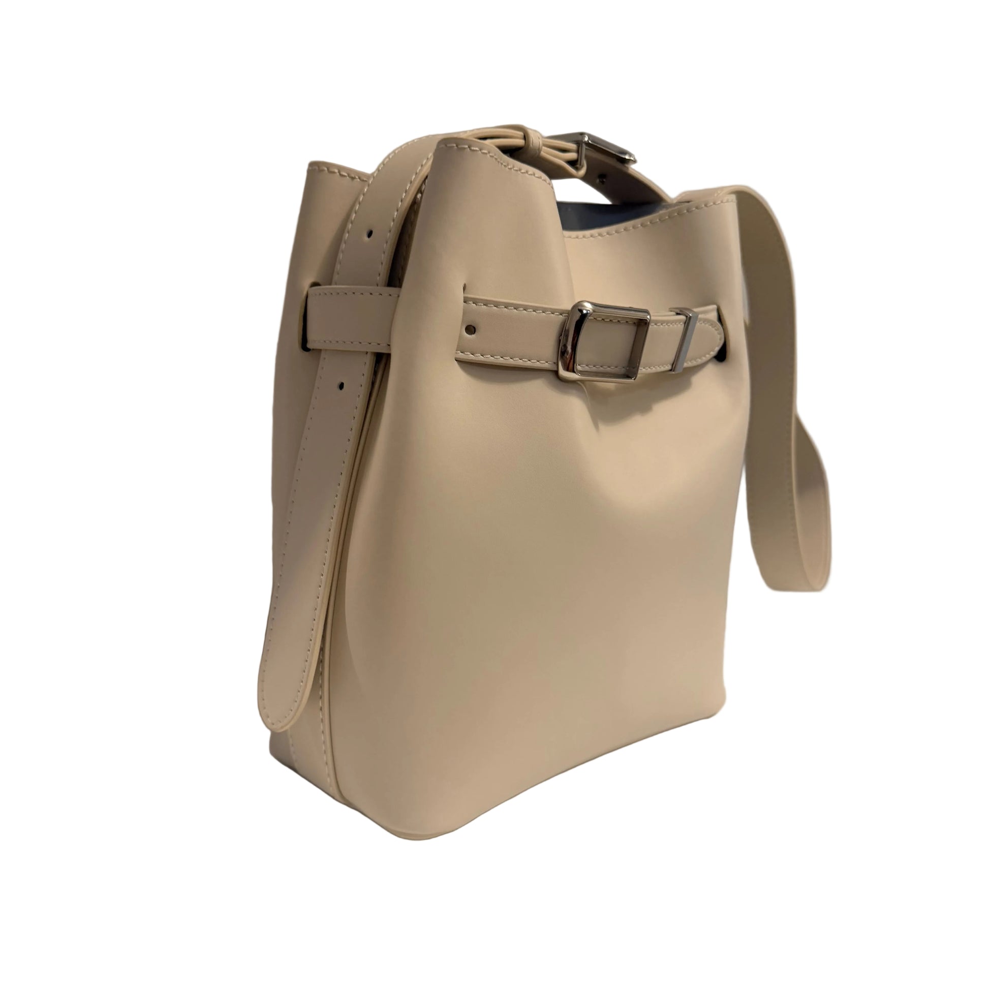 Beige handbag with a strap on a light gray background
