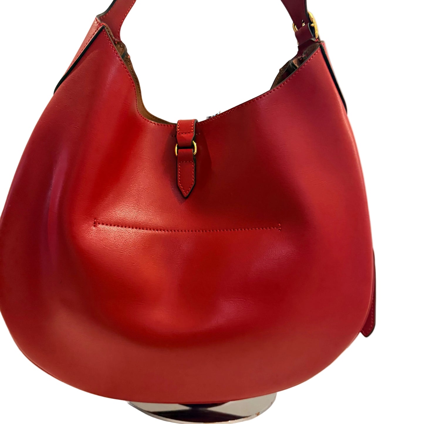 Red leather handbag on a white background