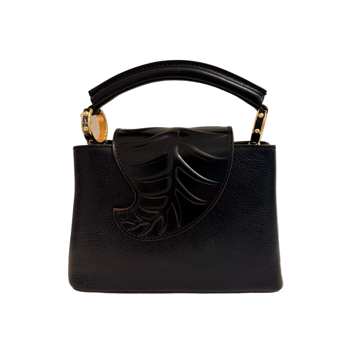 Black handbag with a decorative bow on a neutral background