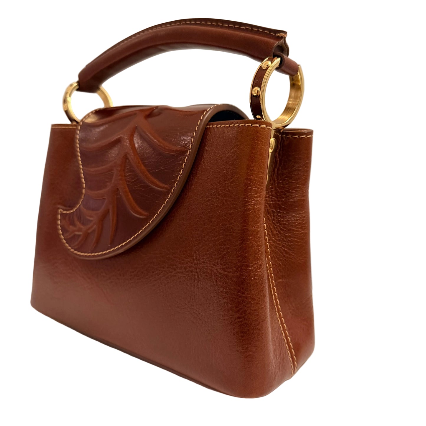 Brown leather handbag with gold accents on a light gray background