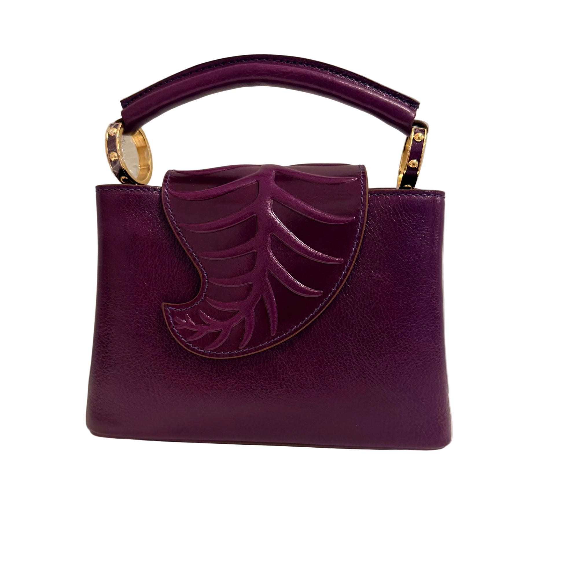 Purple handbag with leaf design on a neutral background