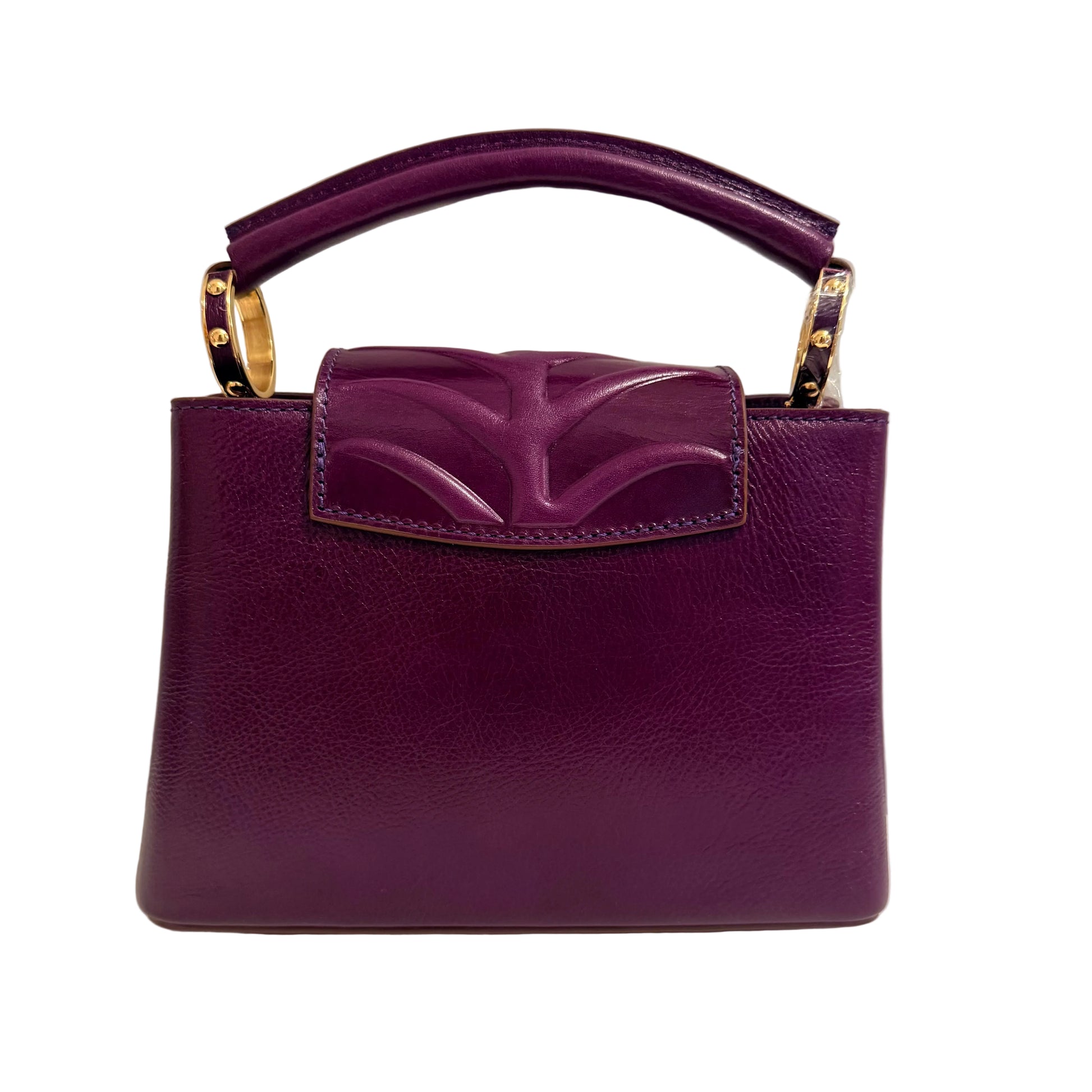 Purple handbag with gold accents on a neutral background