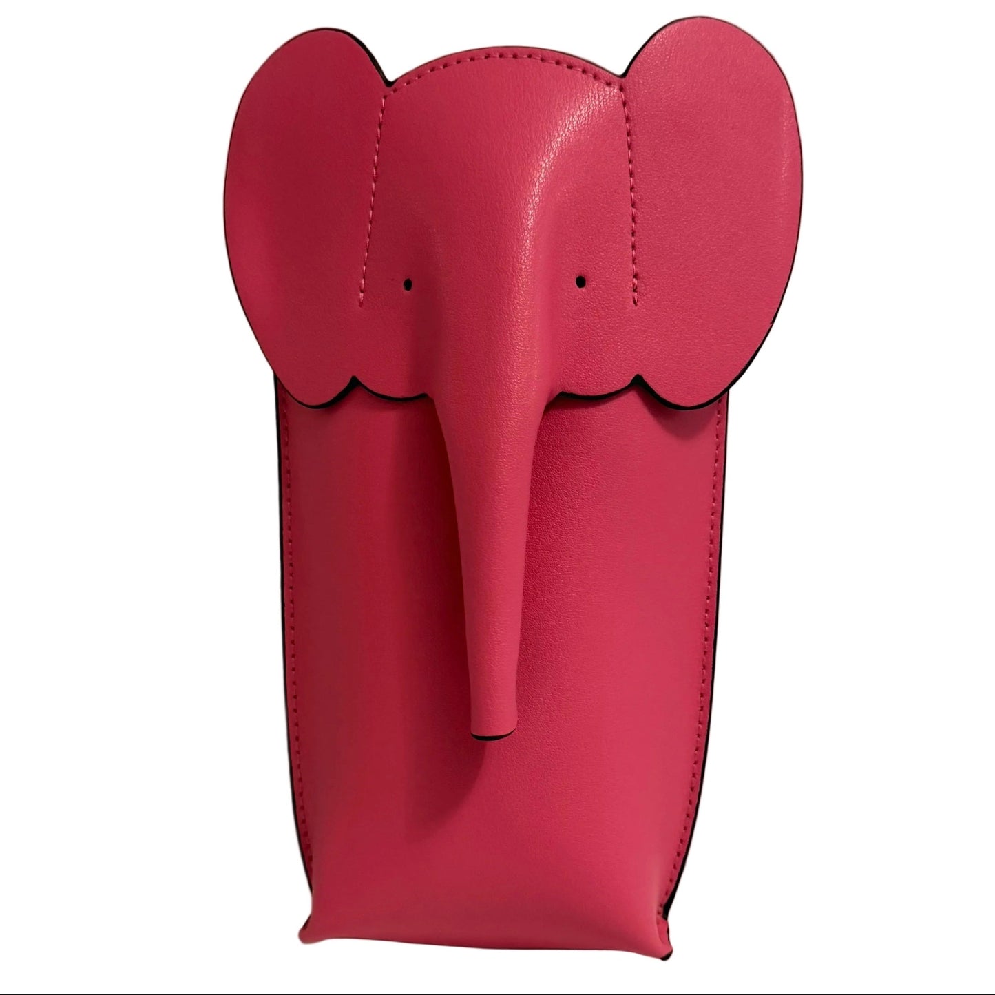 Pink elephant-shaped object on a white surface with a gray background