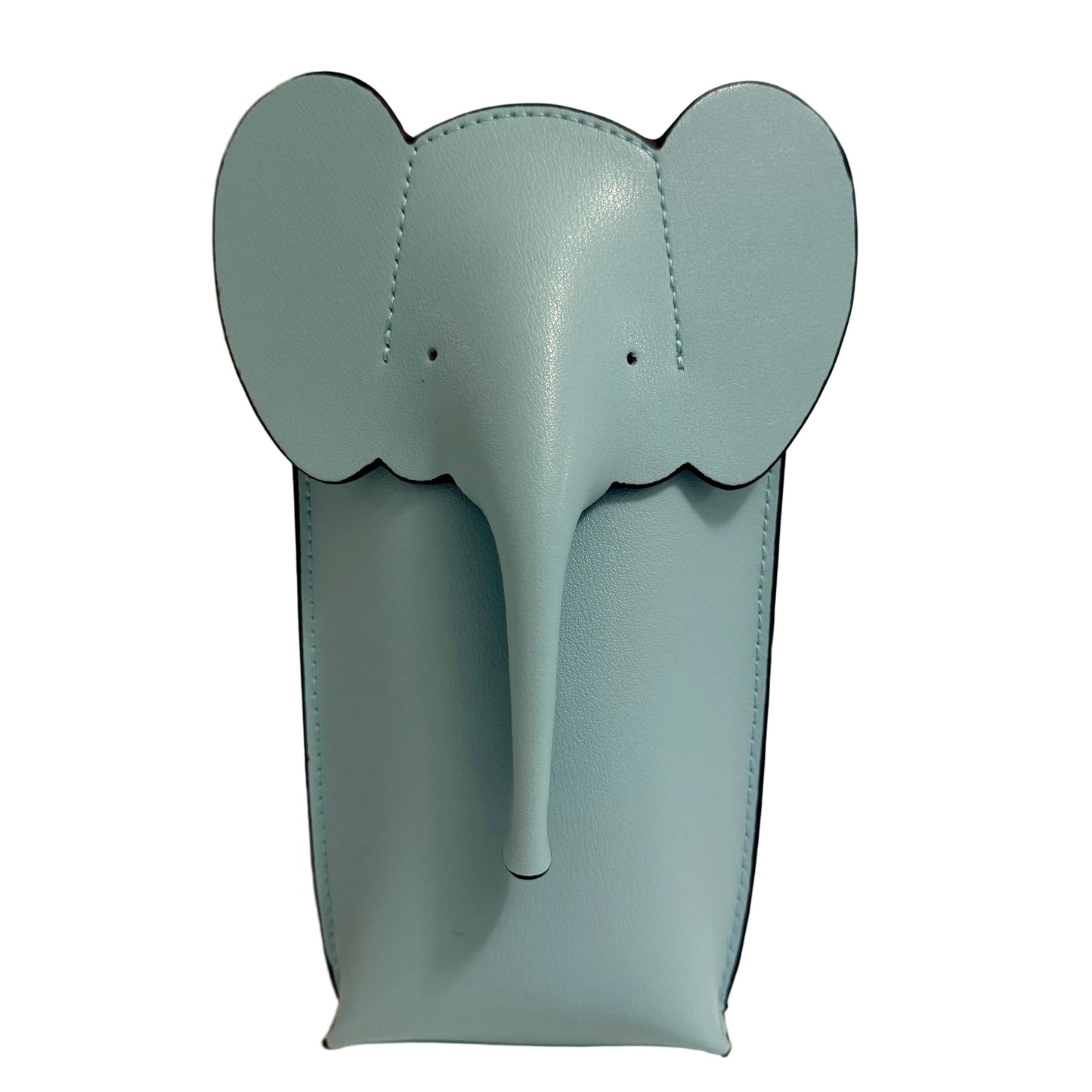 Blue elephant-shaped object on a beige background