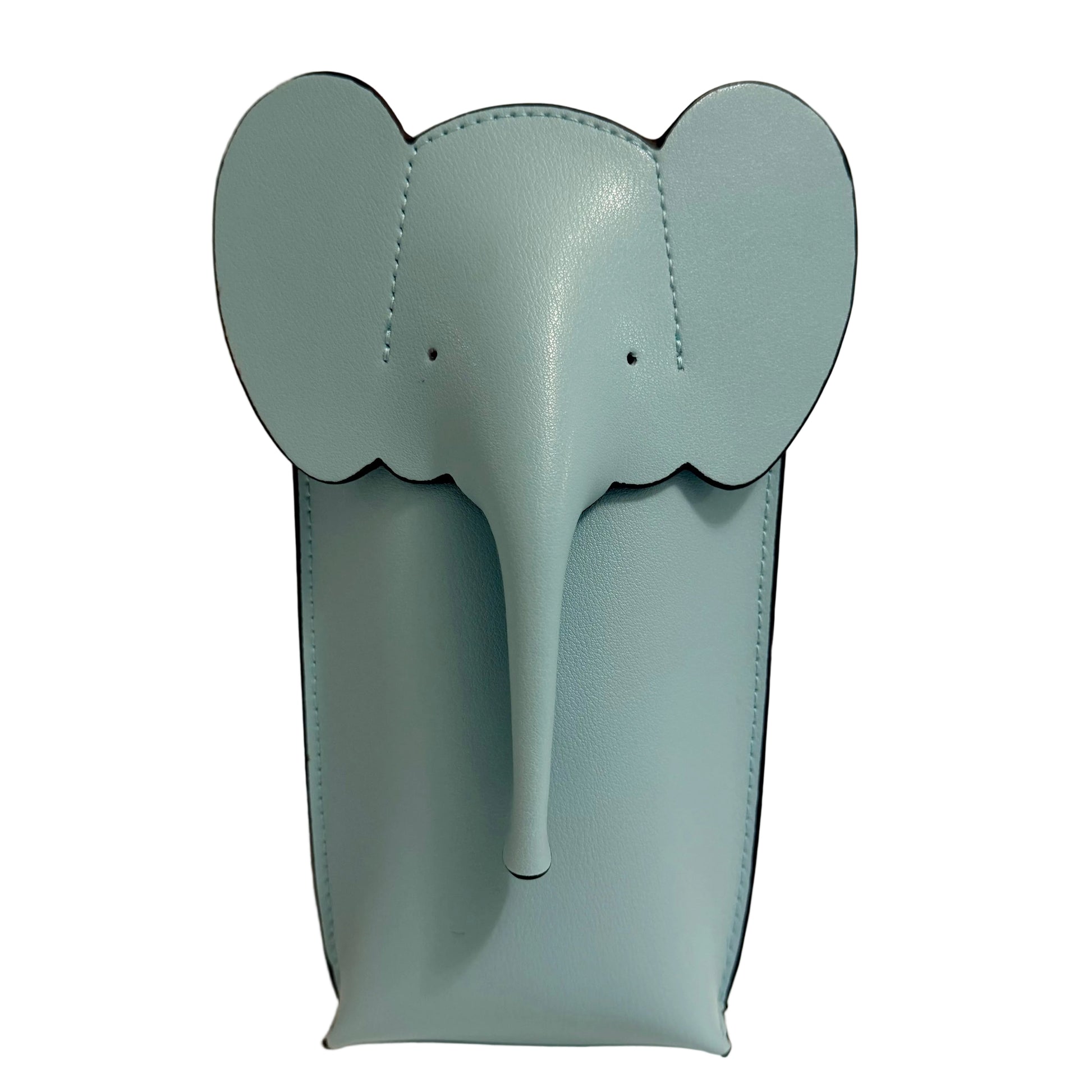 Blue elephant-shaped object on a beige background