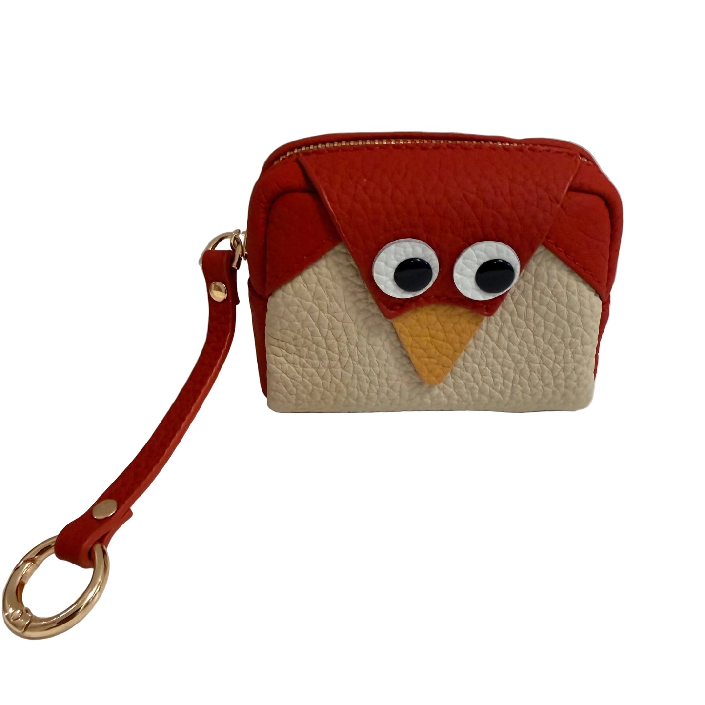 Small purse designed like a bird with a red top and beige bottom on a white surface.