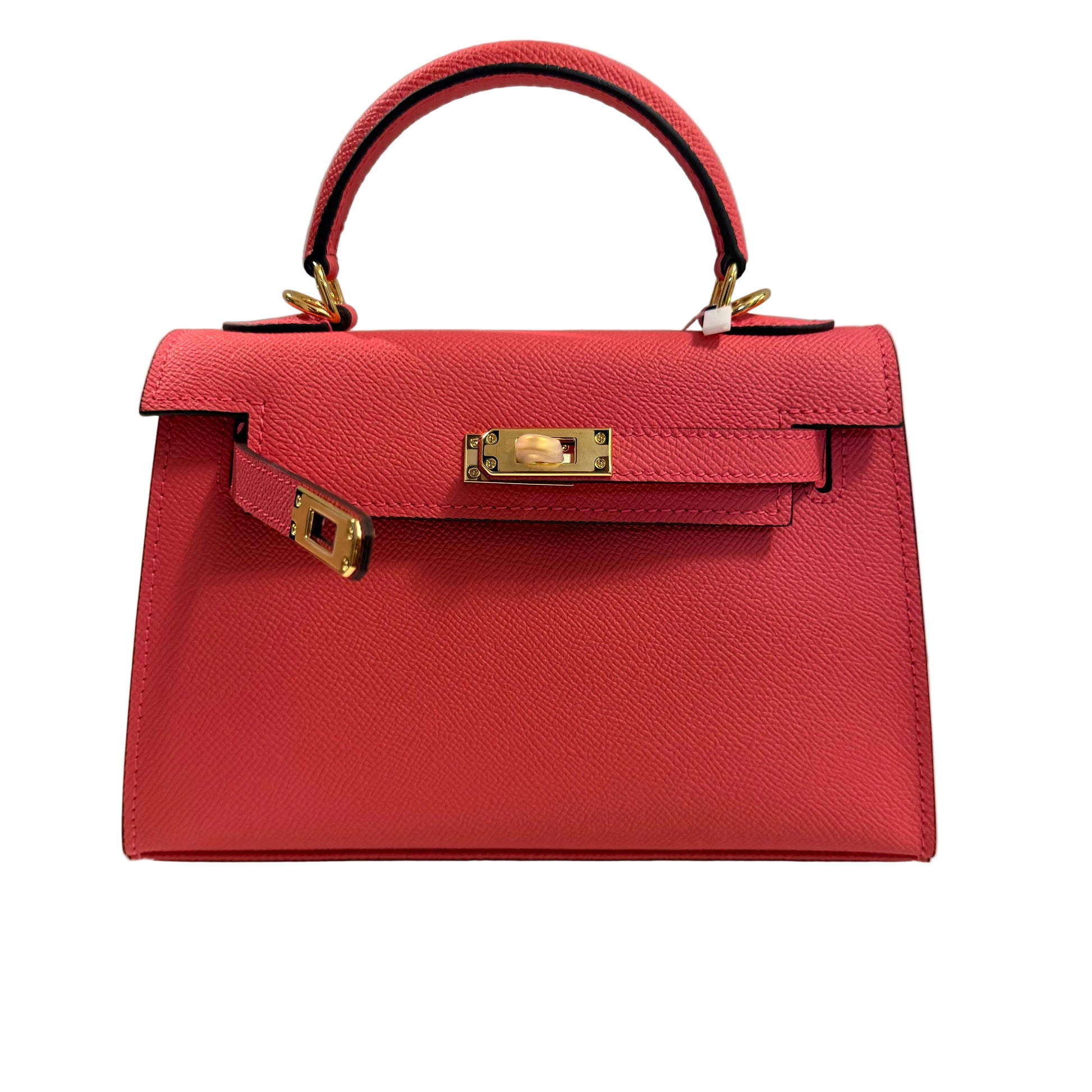 Red handbag with gold hardware on a light gray background