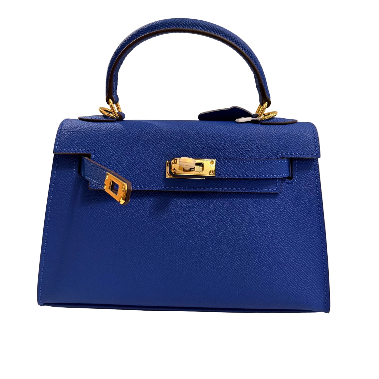 Blue handbag with gold hardware on a neutral background
