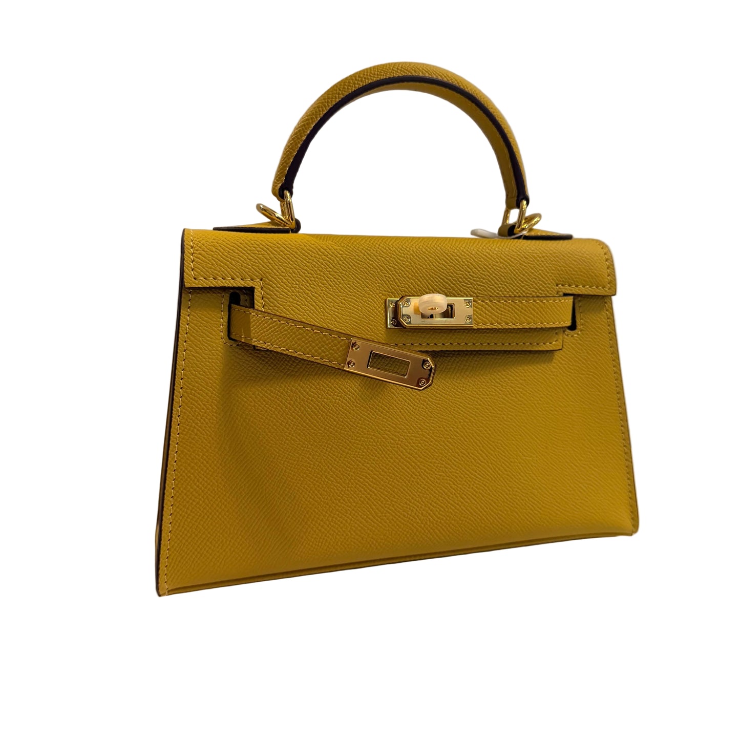 Yellow handbag with gold hardware on a light gray background