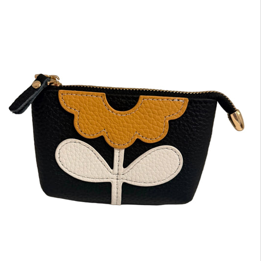Small pouch with floral design on a neutral background