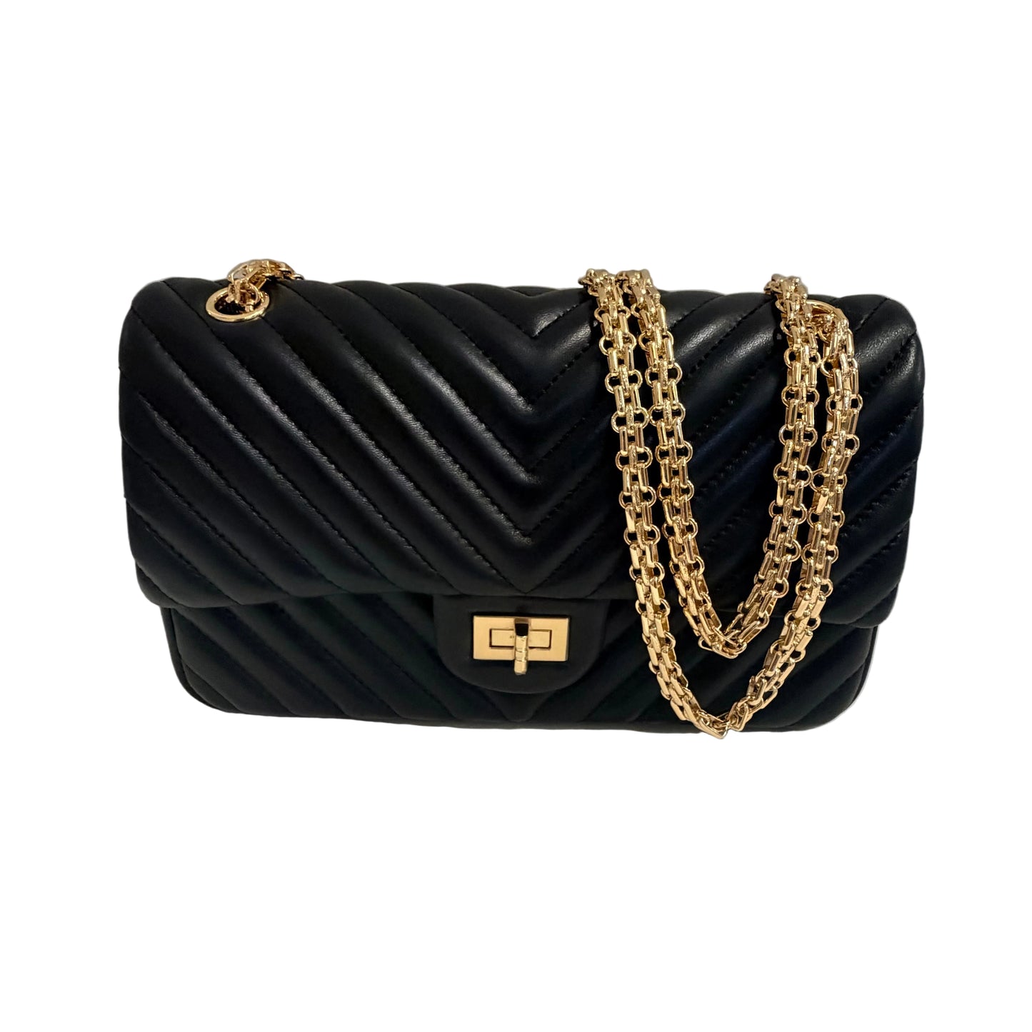Black quilted handbag with gold chain strap on a light gray background
