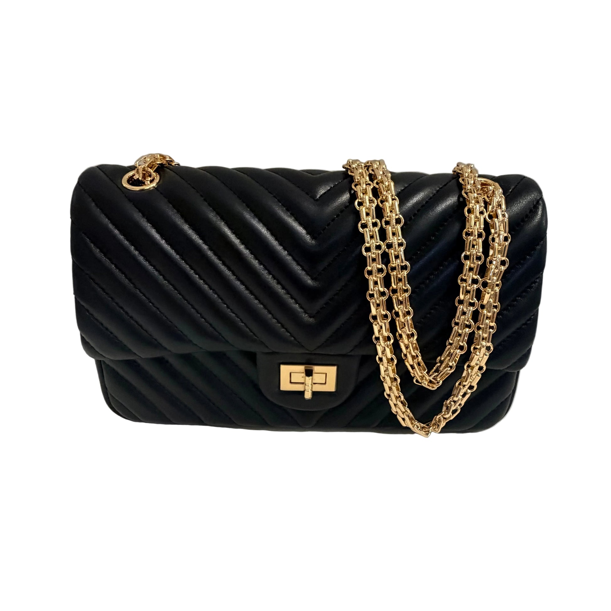 Black quilted handbag with gold chain strap on a light gray background