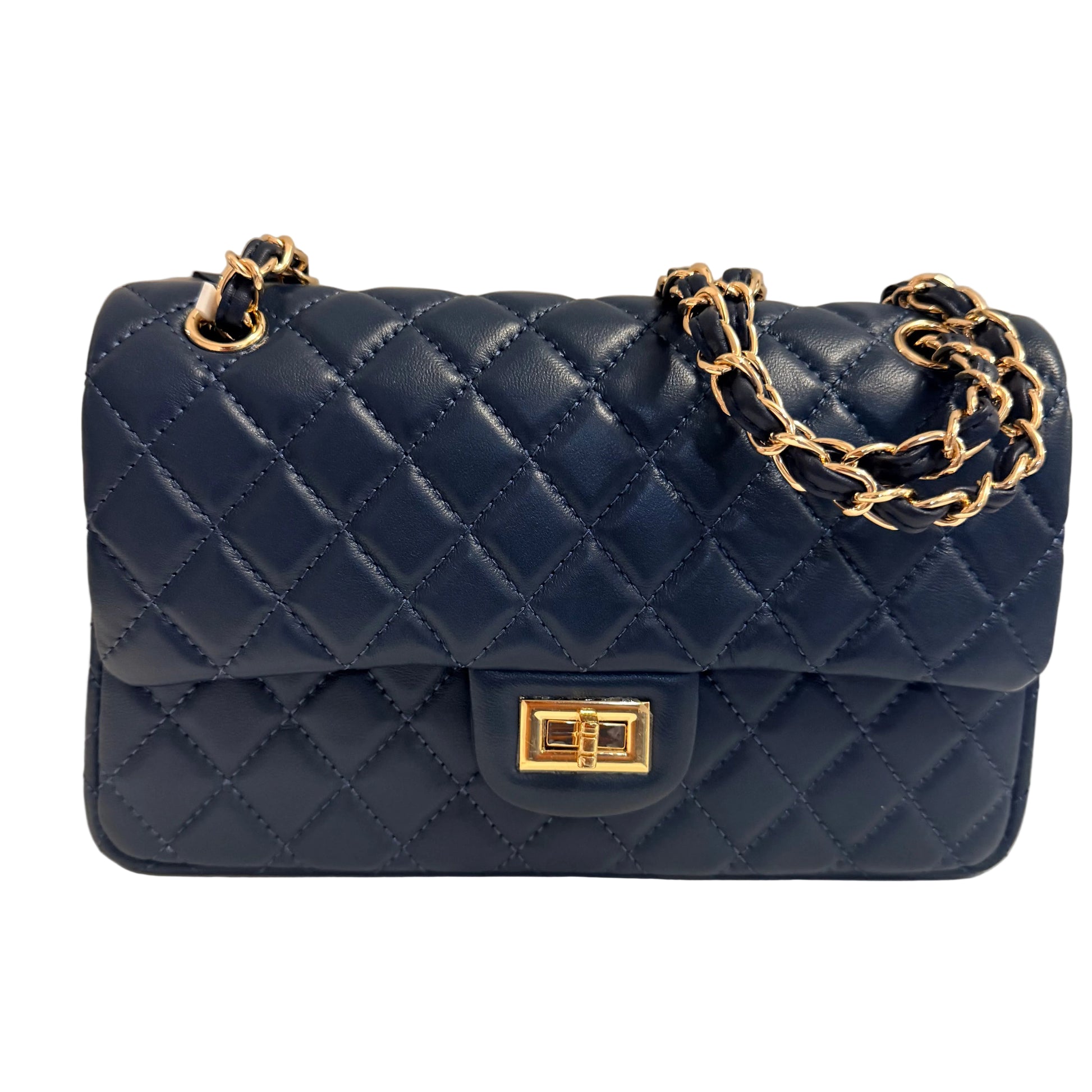 Blue quilted handbag with gold chain and clasp on a neutral background